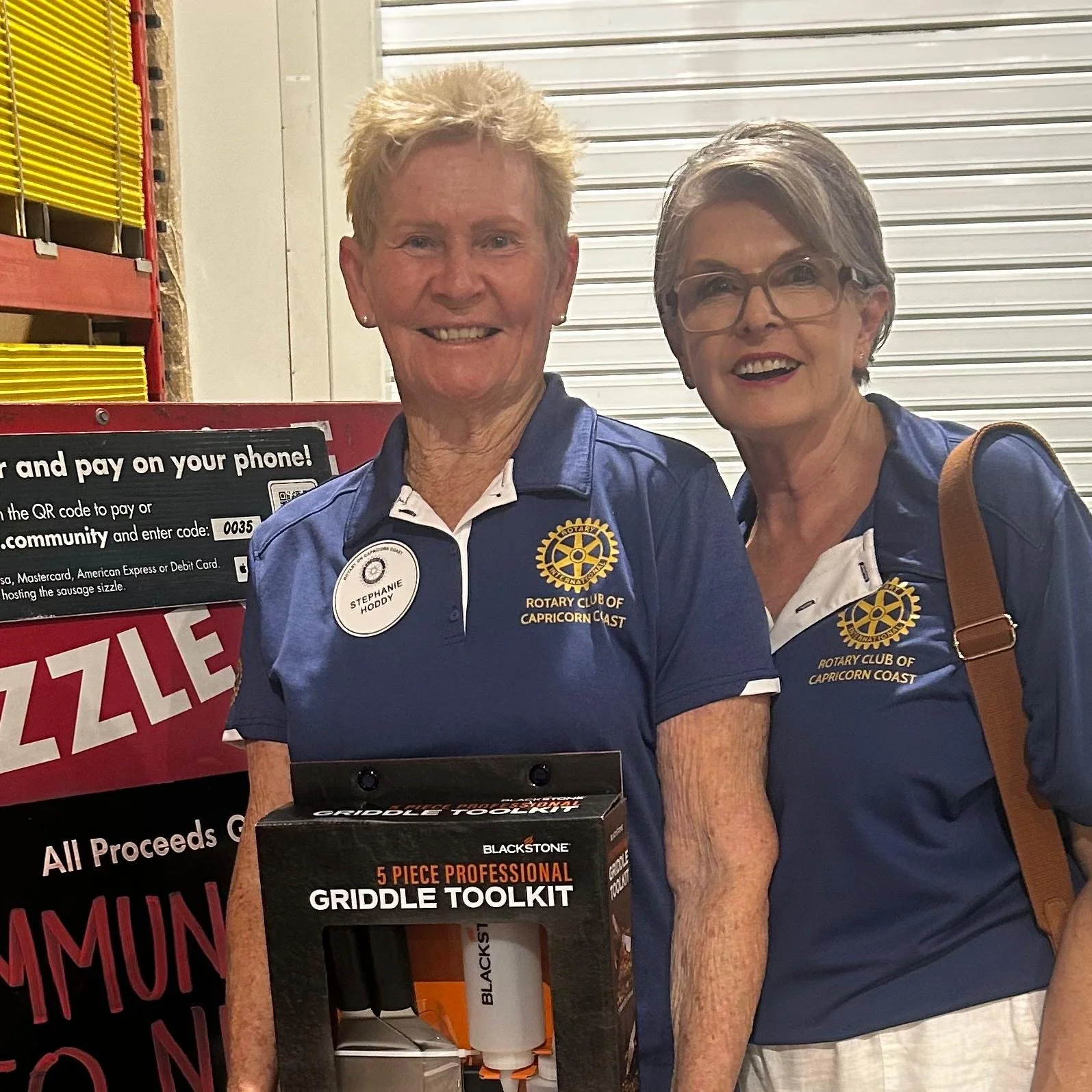 Two women wearing Rotary shirts. Pictured are members and 2025 Club president.