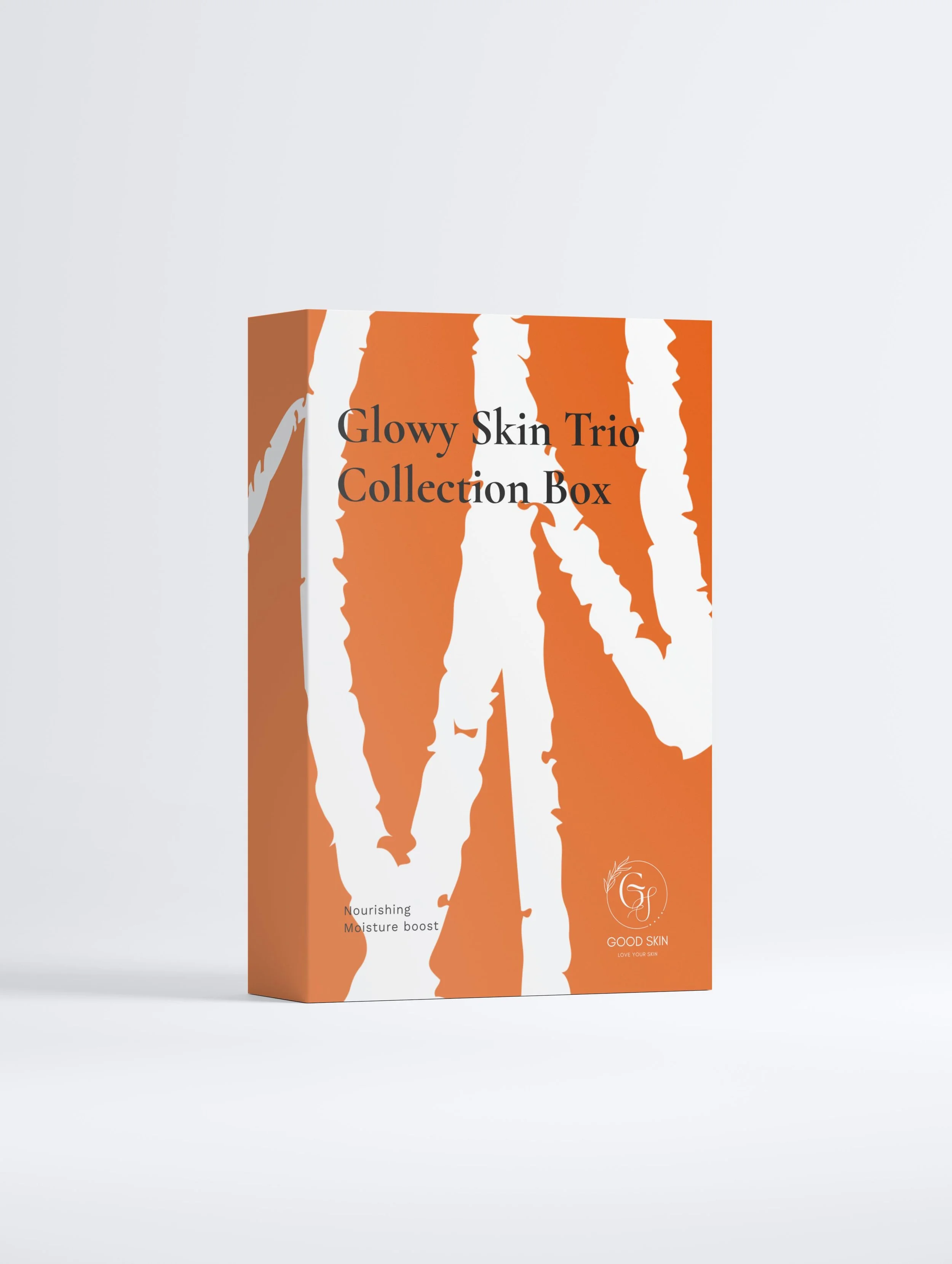 Orange and white striped skincare product box titled 'Glowy Skin Trio Collection Box' with logo and text 'Nourishing Moisture boost' and 'Good Skin' at the bottom.