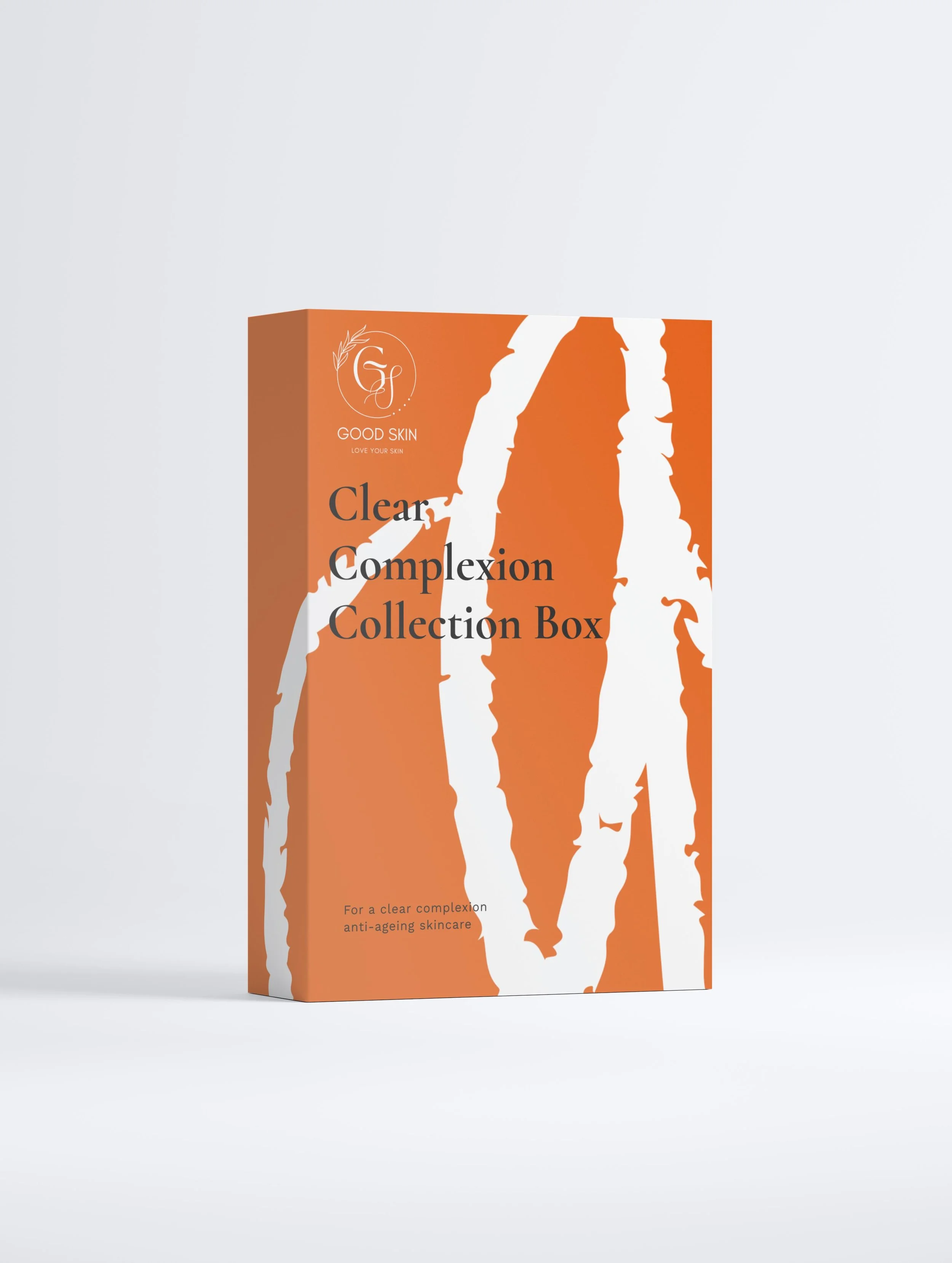 Packaging box for skincare product named 'Clear Complexion Collection Box' by Good Skin, with an orange and white abstract design.