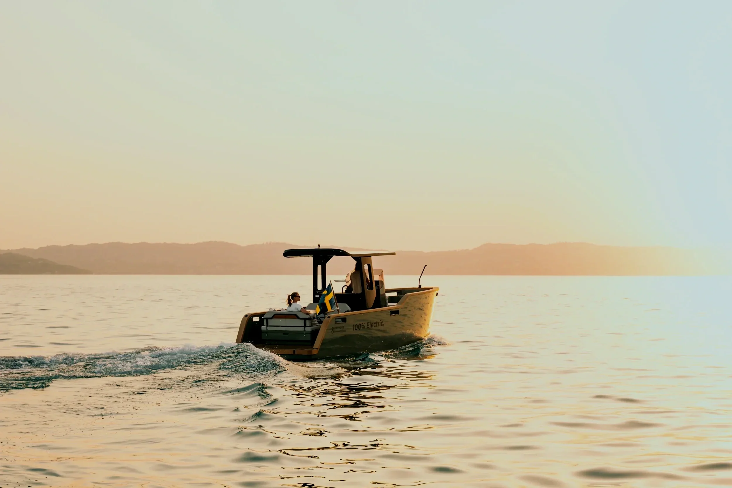 Private electric boat cruising at sunset in Marstrand archipelago Sweden