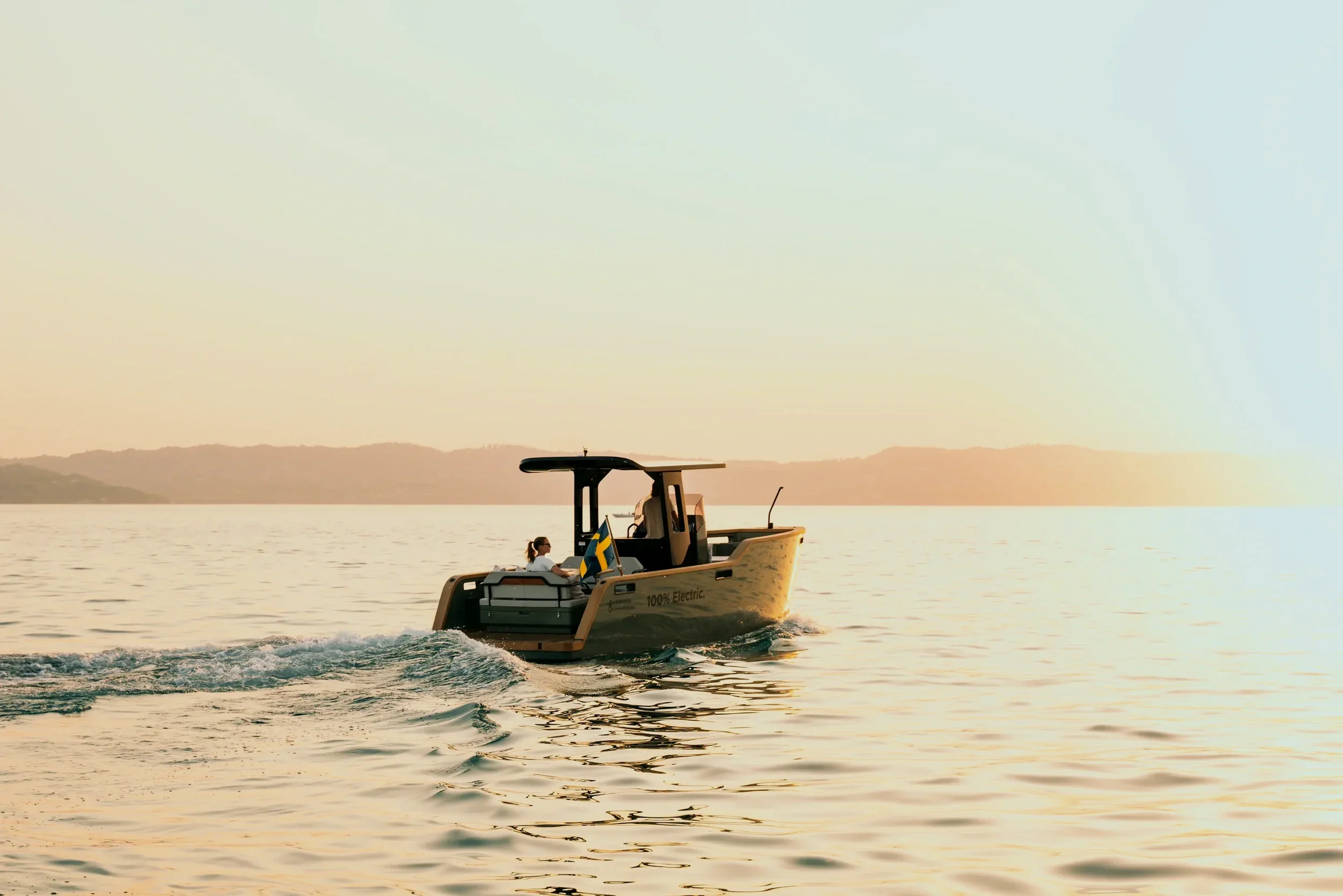 Silent electric boat tour on calm water in Marstrand Sweden during sunset