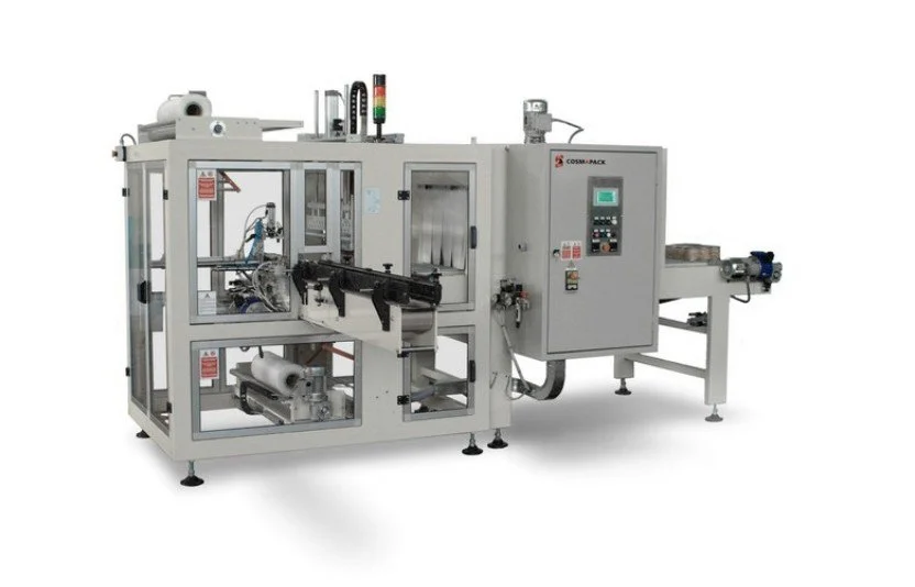 An industrial packaging machine with a conveyor belt and control panel.