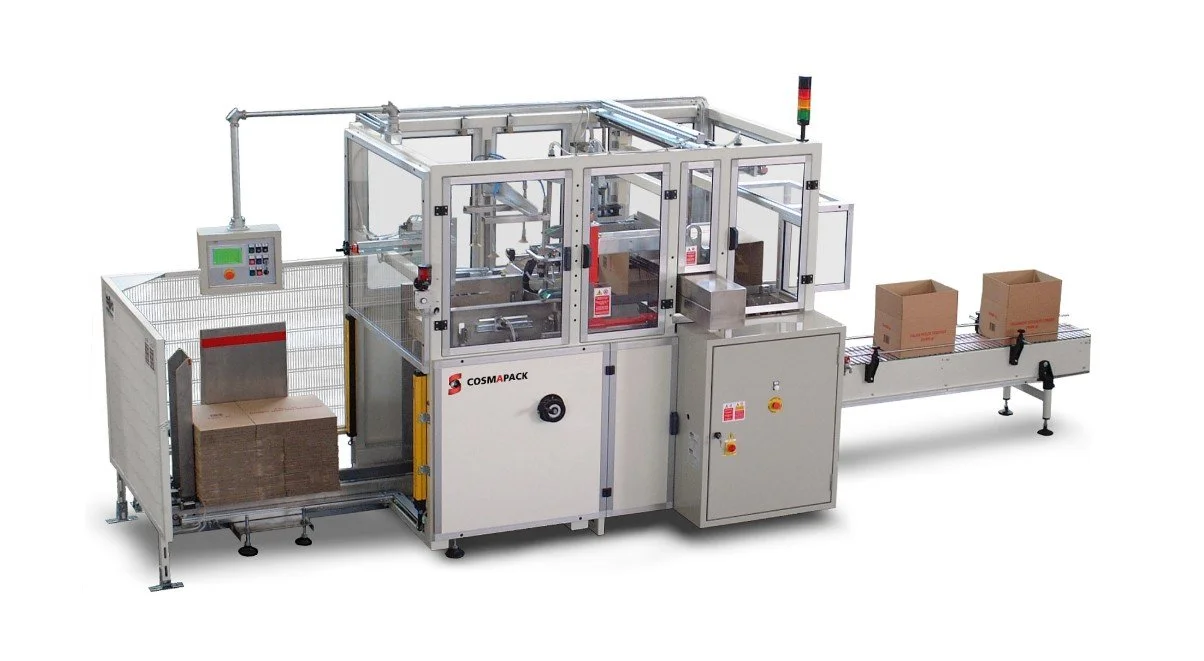 Industrial packaging machine filling and sealing boxes on a conveyor belt
