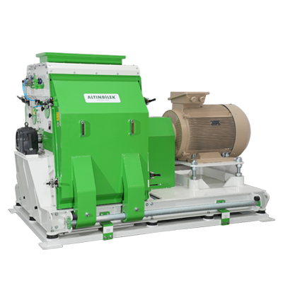 Industrial machine with green and white components and a large beige motor attached.