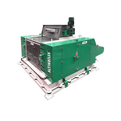 Green industrial machine labeled 'ALTINBELI' with various components and control panels, set on a white platform.