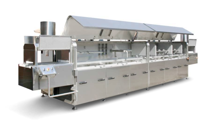 Large industrial food processing machine made of stainless steel.