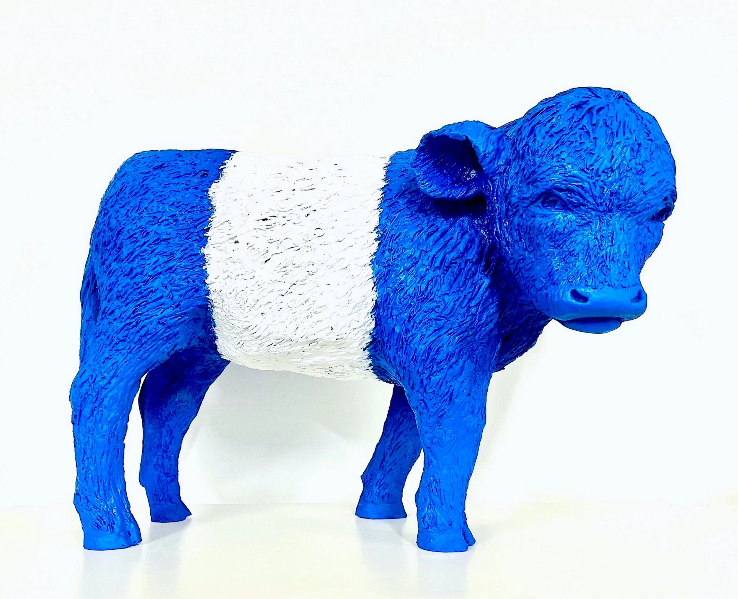 Blue and white painted model of a buffalo.