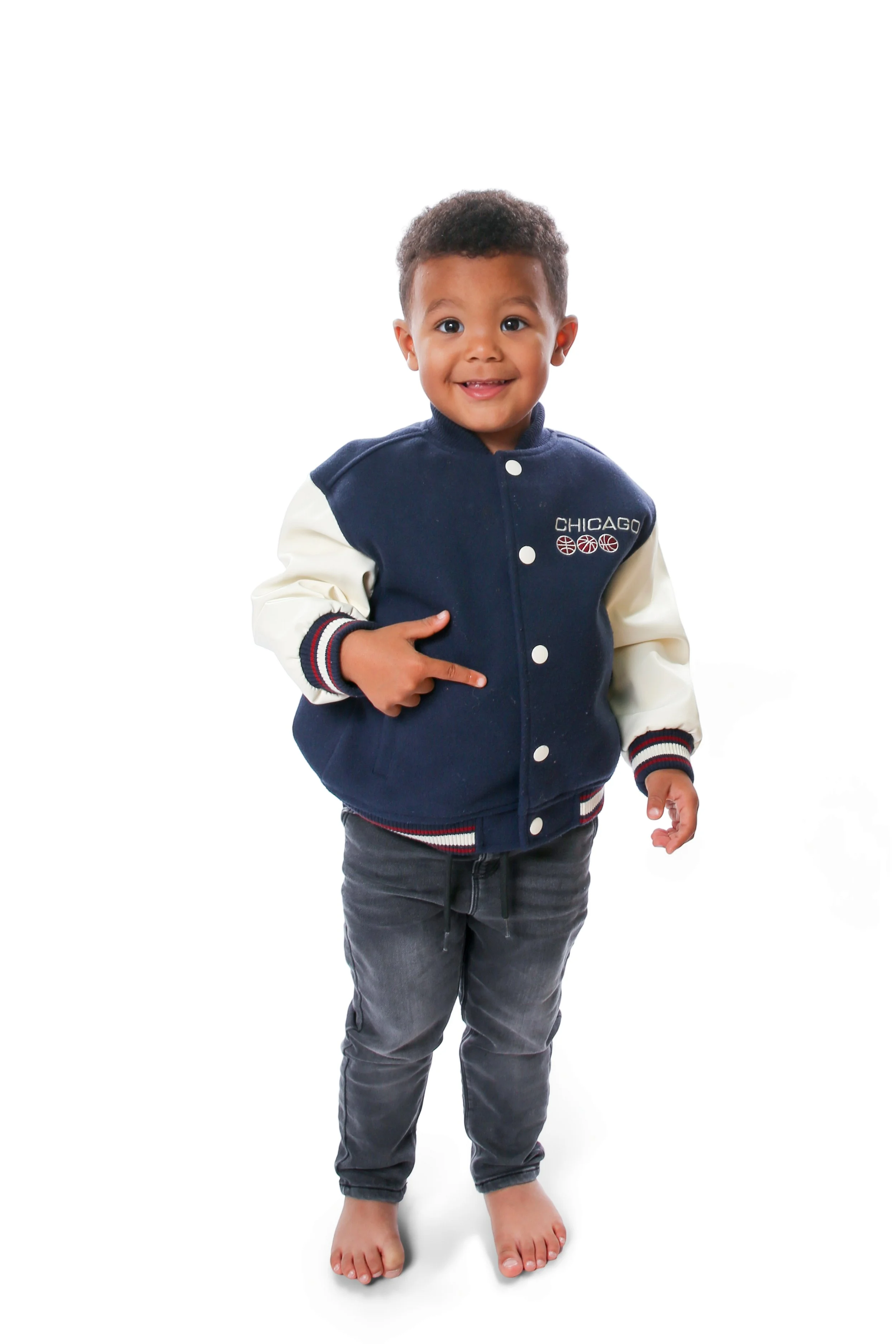 Boy child naturally playing and posing for a nursery portrait session in Bacup