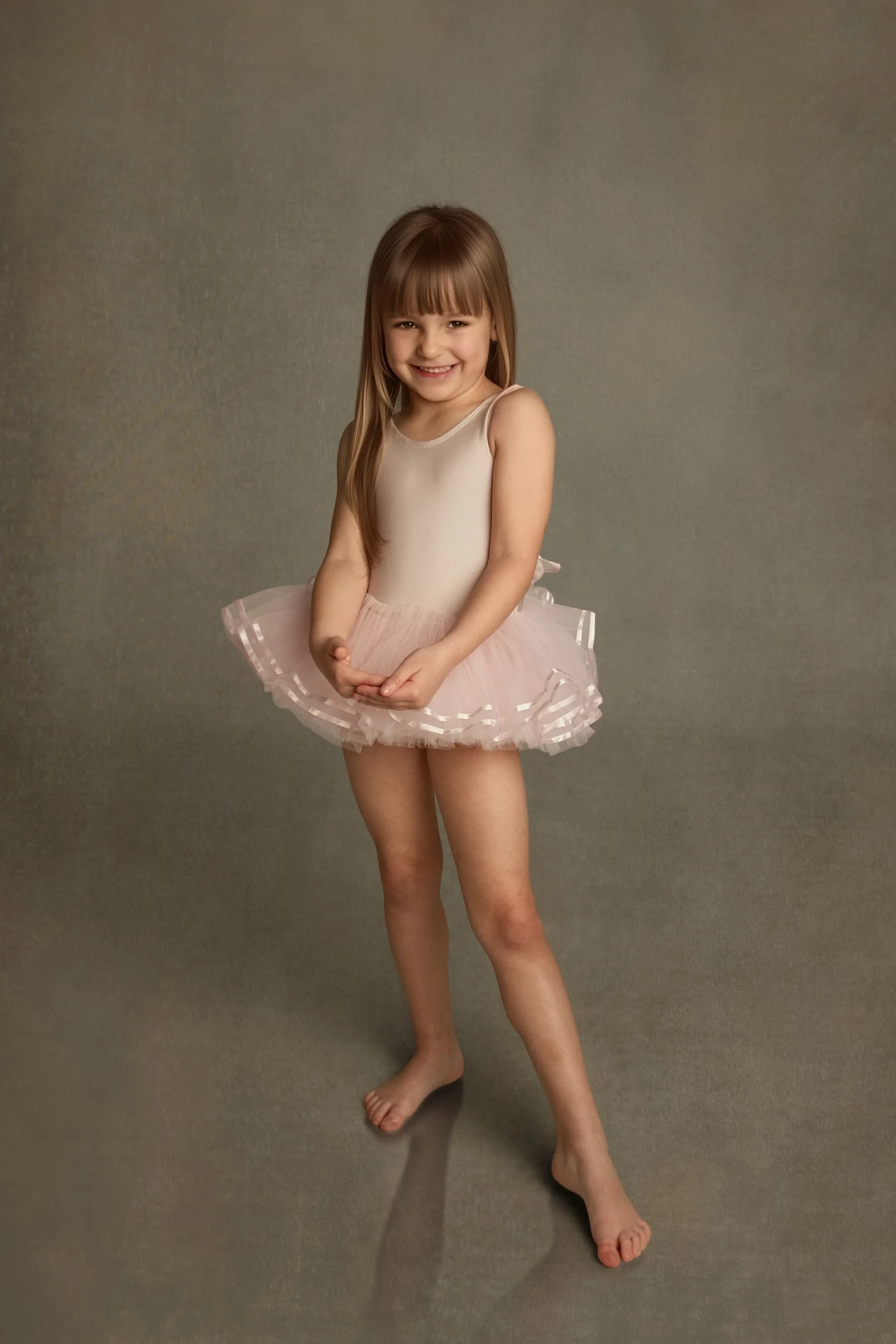 Fine art portrait of young ballet girl posed elegantly, captured in a timeless children’s fine art style.