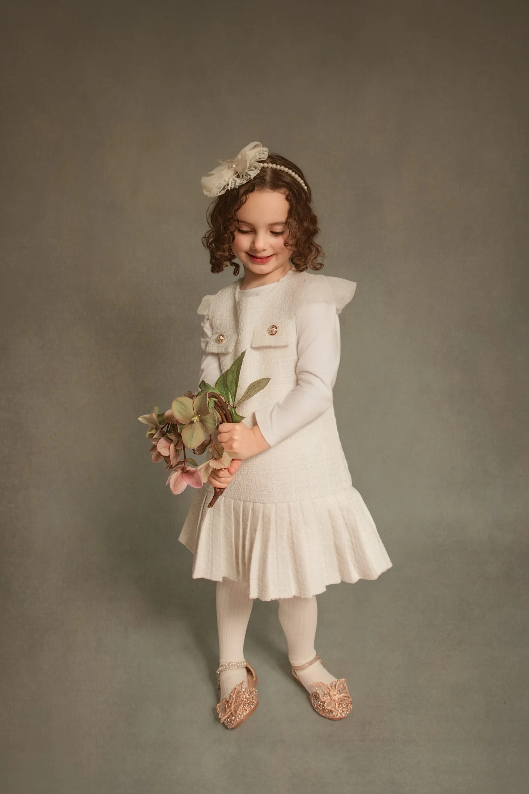 Standing holding flowers
Fine art children’s portrait of young girl holding flowers, classic fine art photography style in Bury, Greater Manchester.