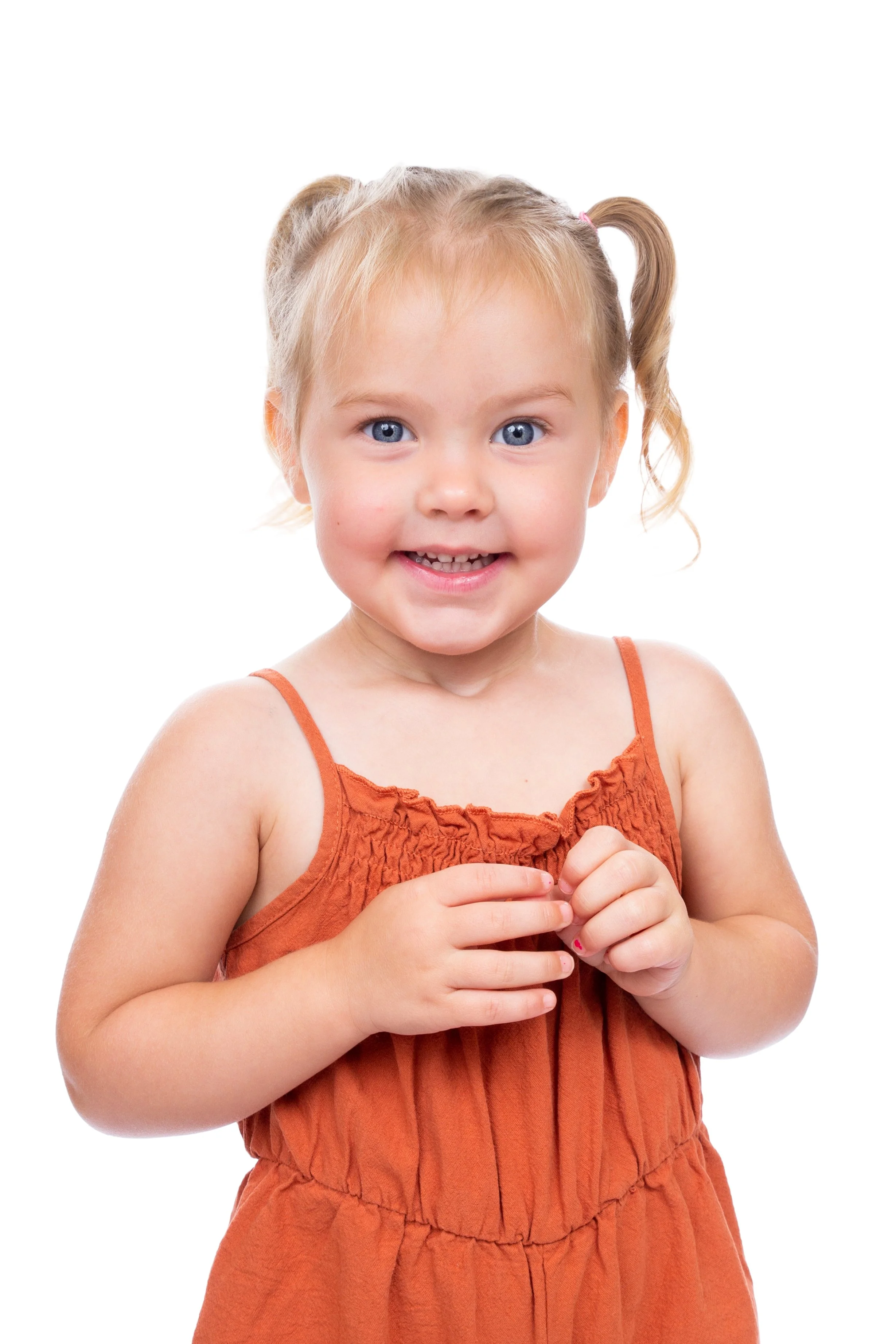 pre school girl smiling in a nursery pre-school photography session in Oldham