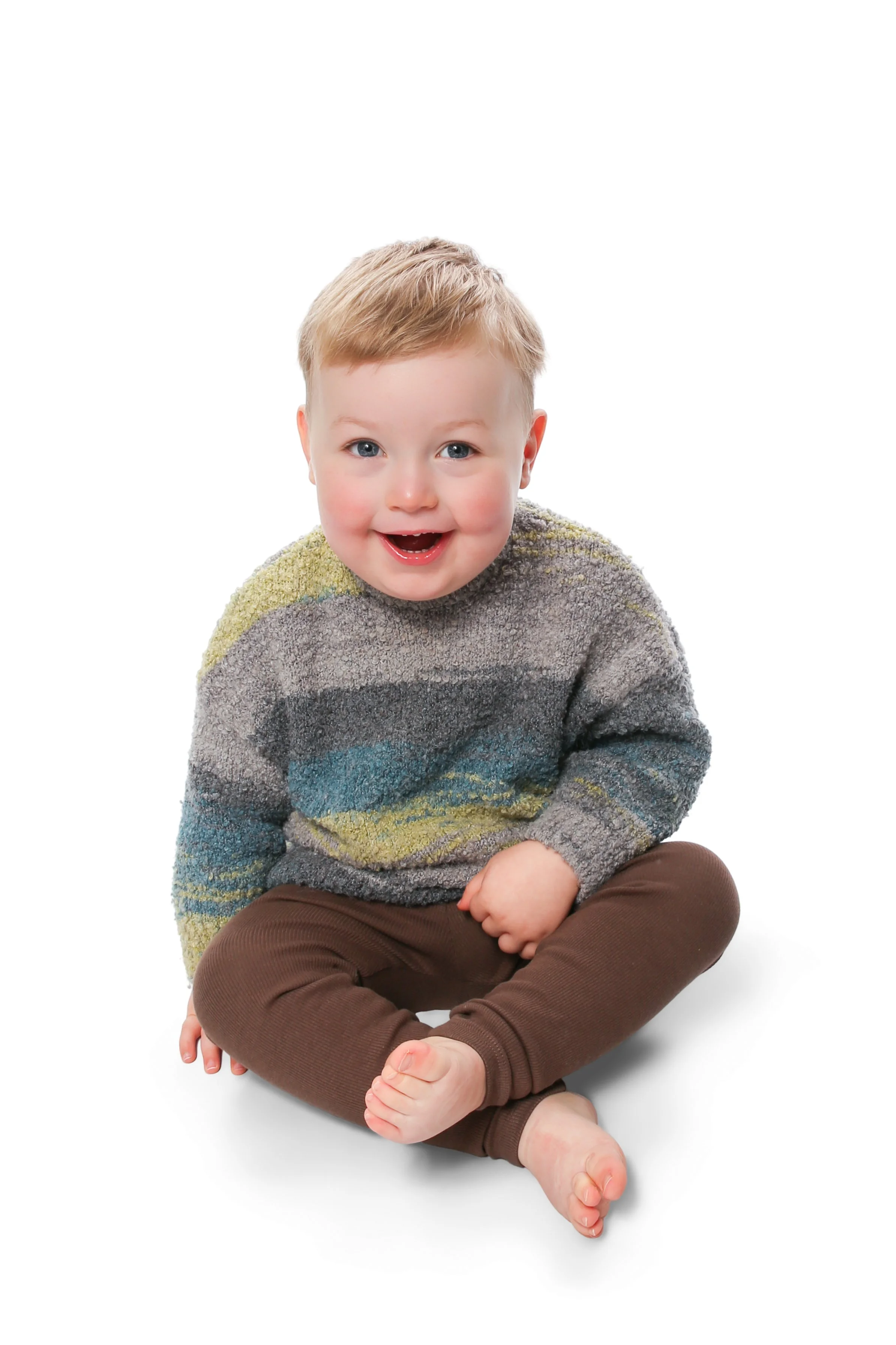 Boy child captured naturally during a nursery portrait photography session in Heywood
