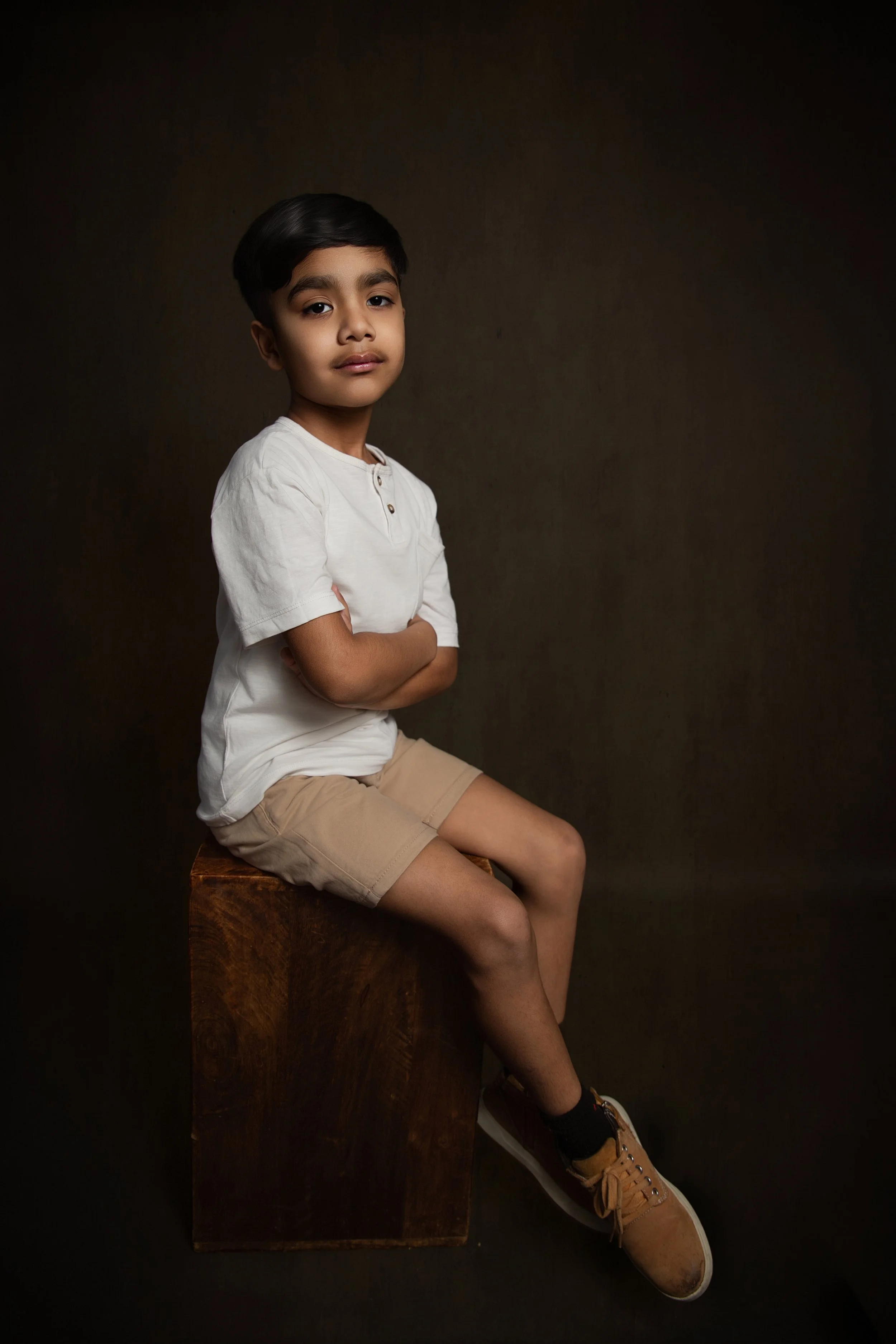 Sophisticated at-home portrait of a young boy in Oldham, professionally lit and beautifully posed