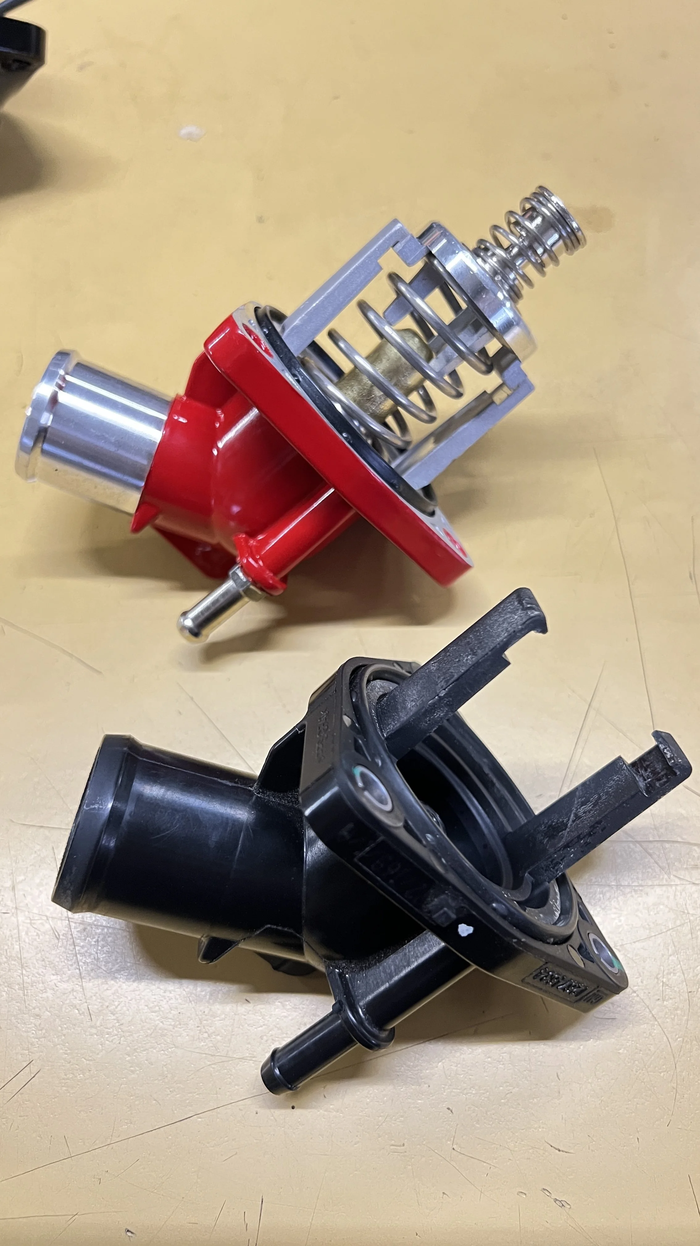 LT4 Aluminum Thermostat compared to OEM Plastic housing