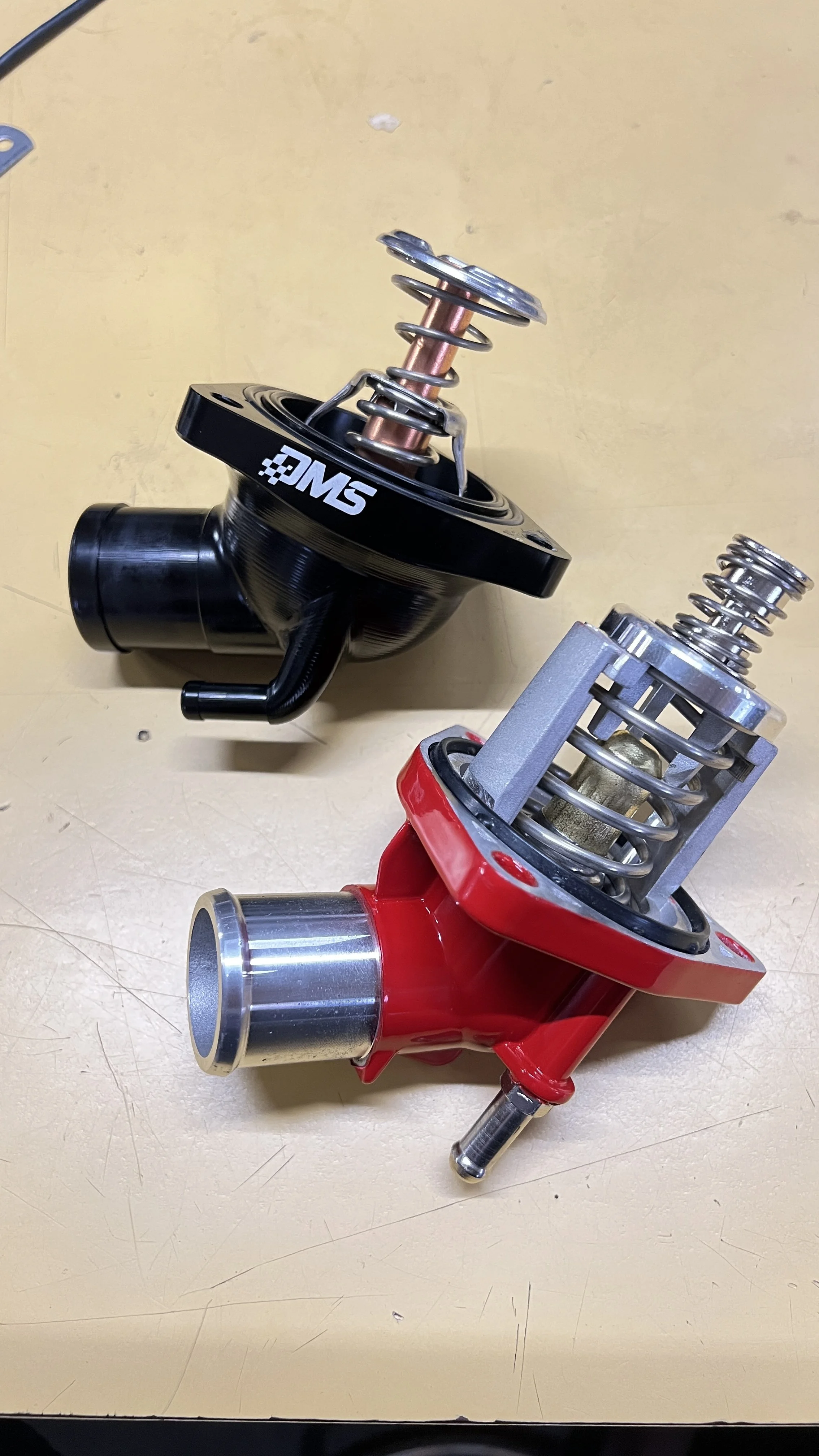 DMS Billet housing with LS3 Thermostat compared with LT4 Aluminum Thermostat OEM housing