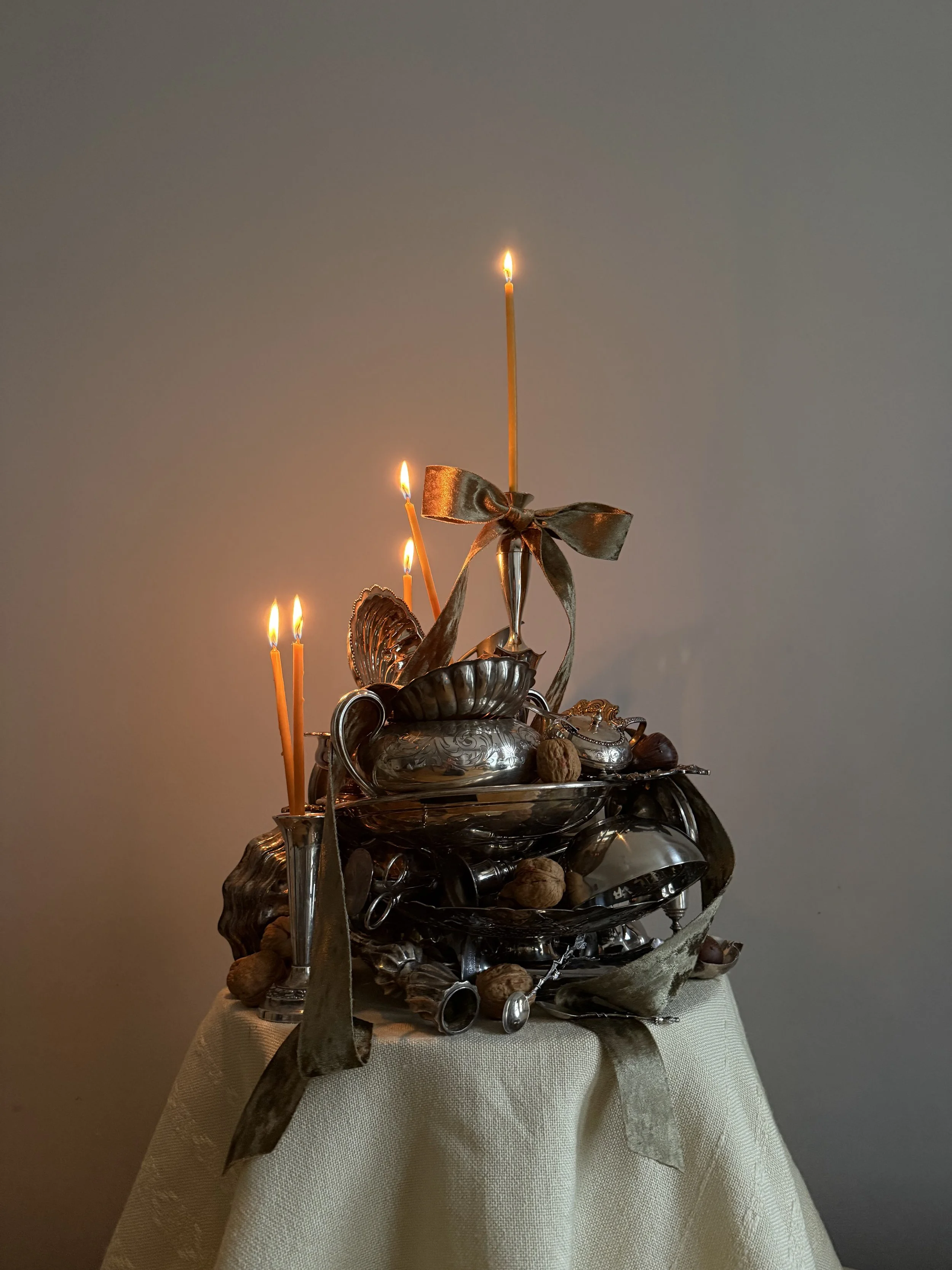 Silver sculpture table setting arrangement candles .jpeg
