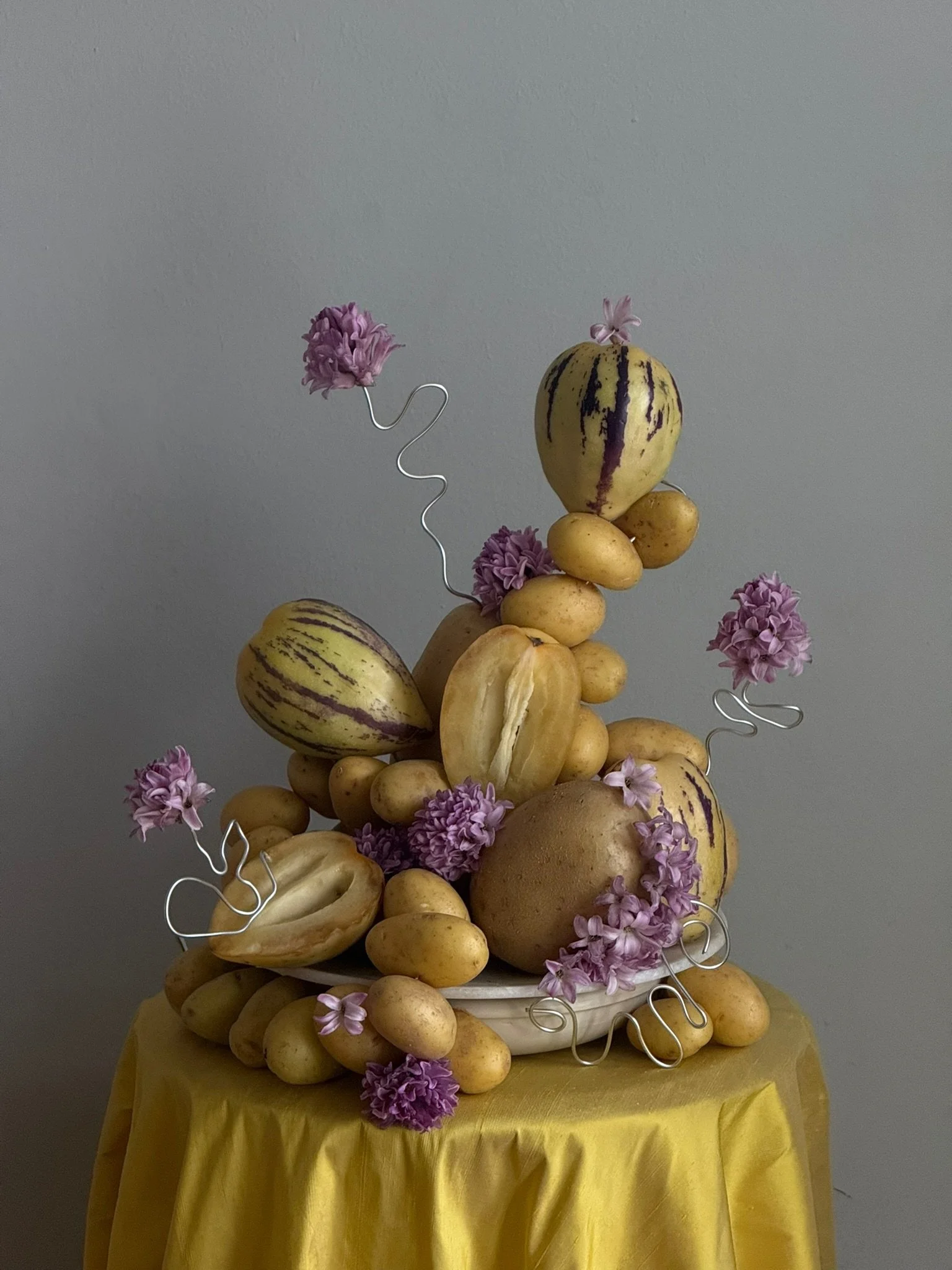 Fruit sculpture event flower arrangement lilac yellow table styling.JPG