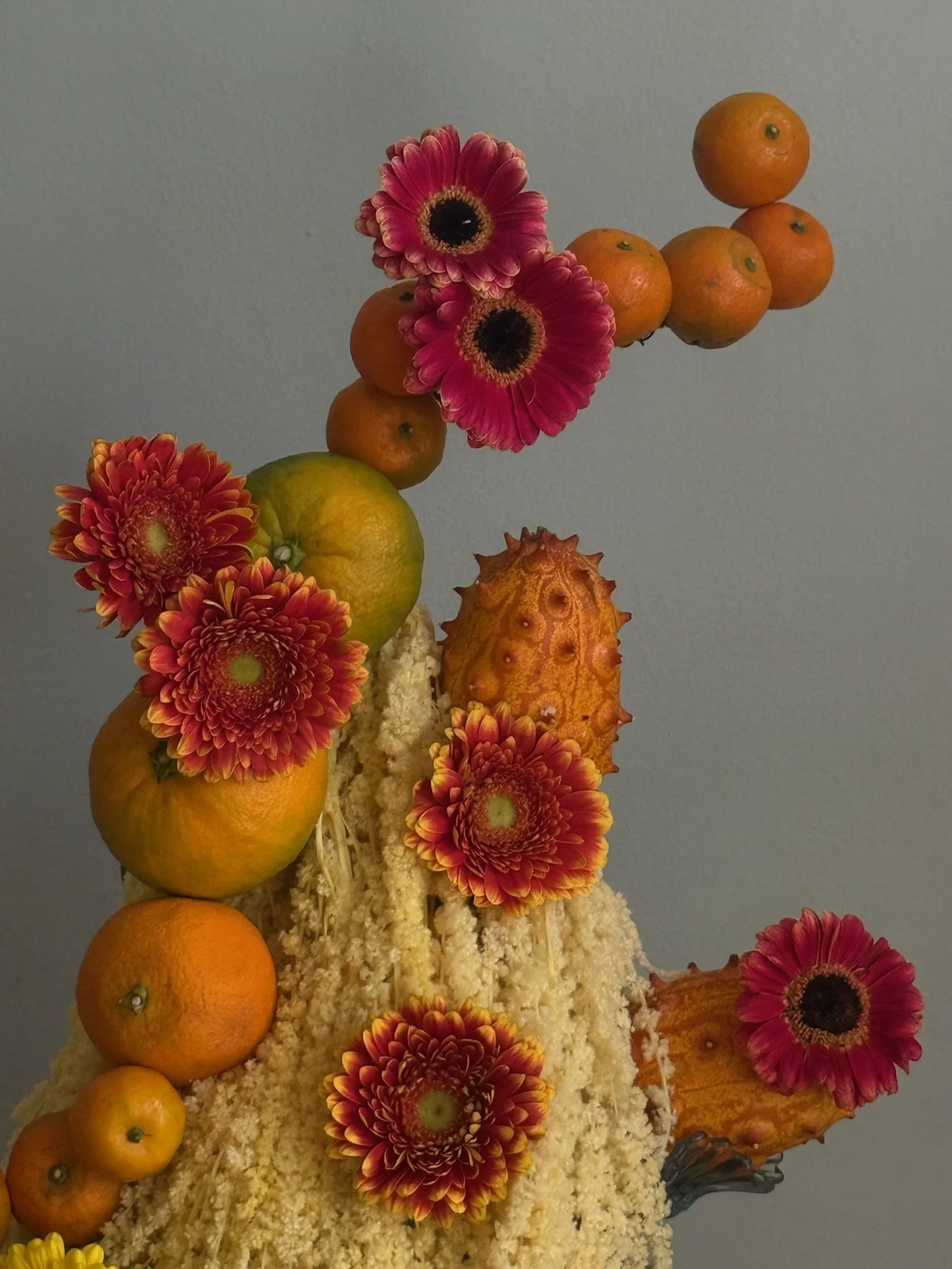 Orange fruit flower arrangement event sculpture gerbera.JPG