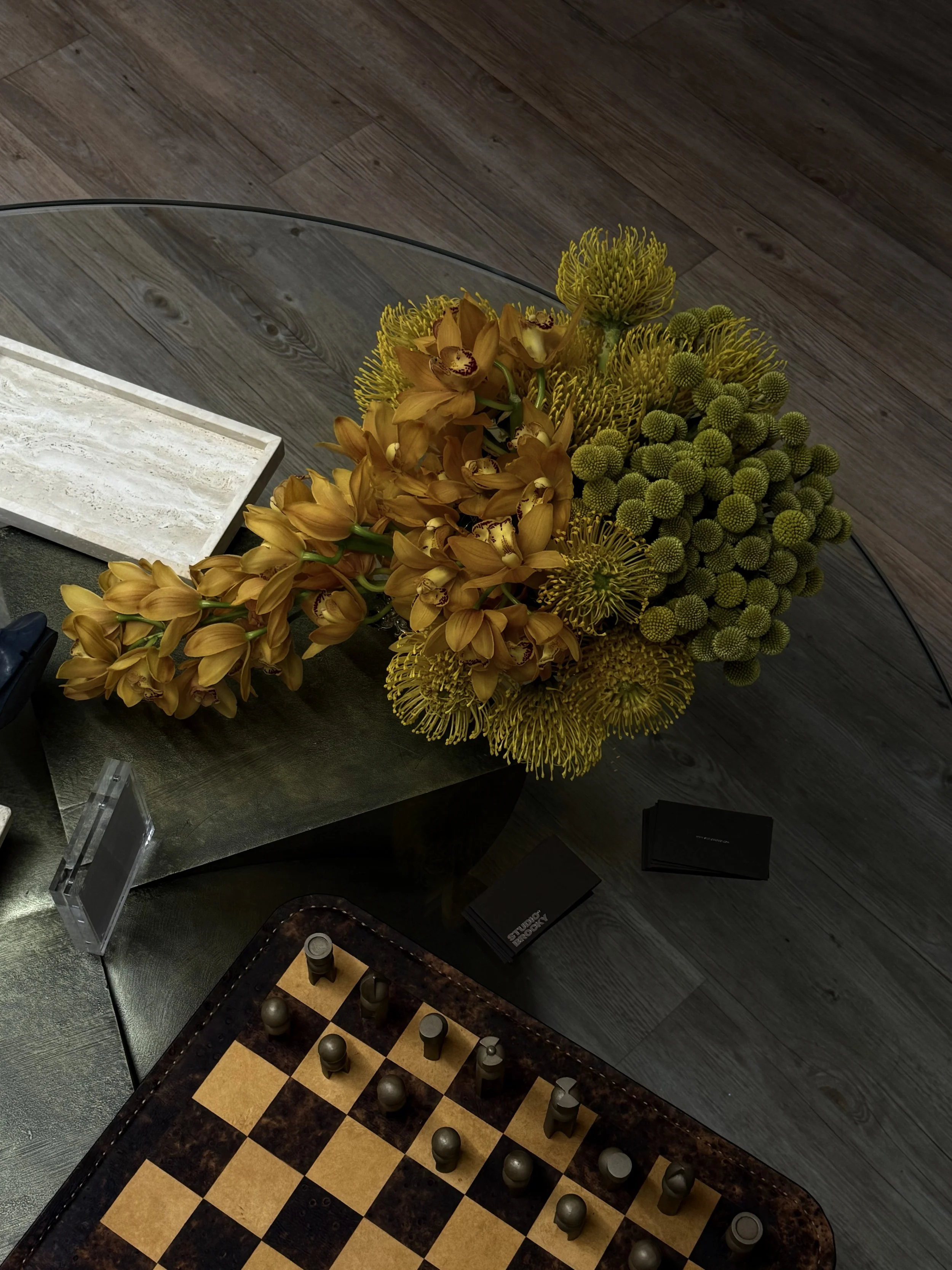 Yellow orchid flower arrangement sculpture table styling .jpeg