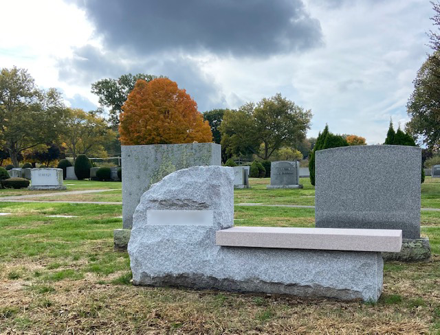 Granite memorial bench providing a personalized resting place tribute.