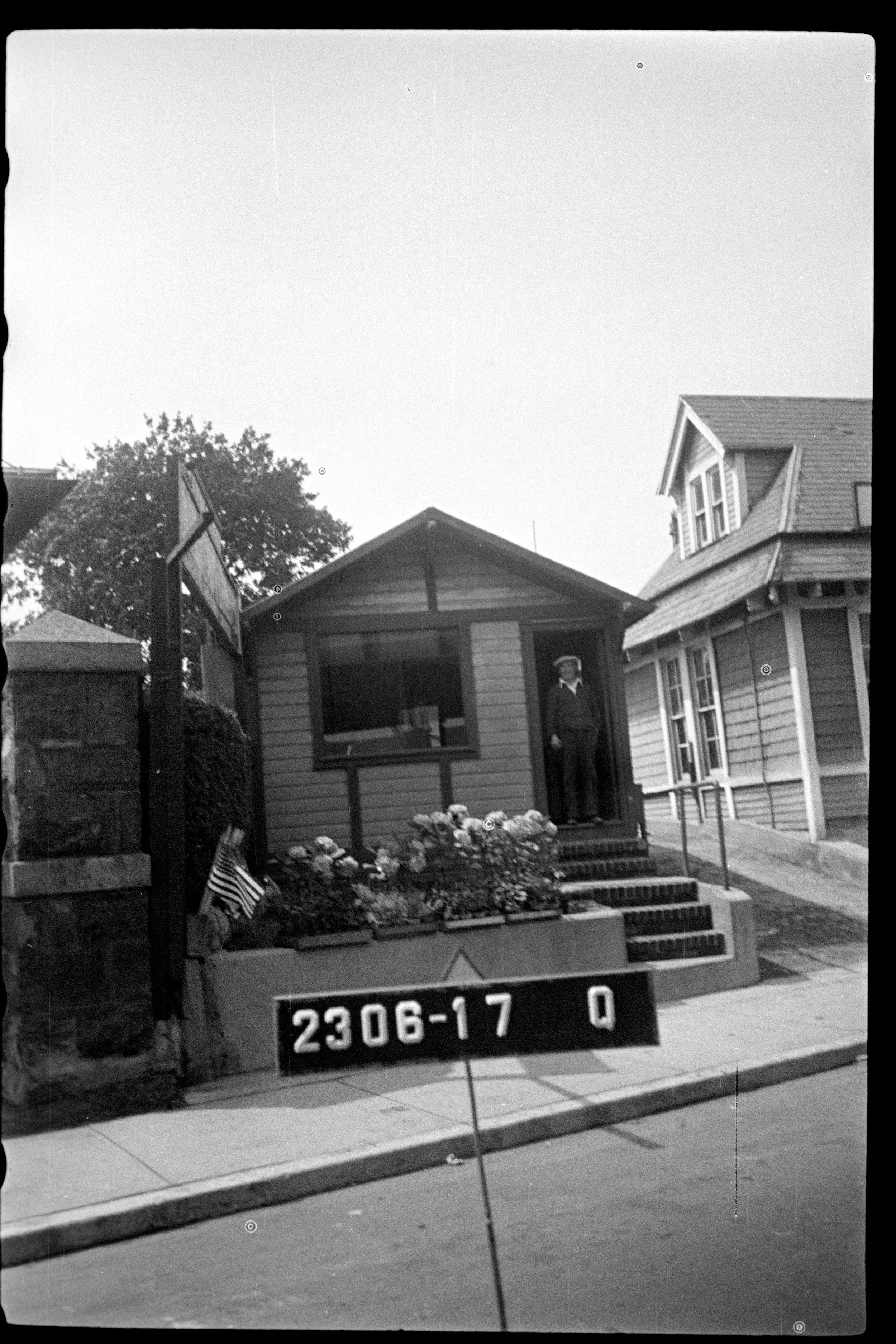 1940's tax photo of the floral shop currently occupied by Leo's Monuments and Floral Co., as well as O'Loughlin's Florist.