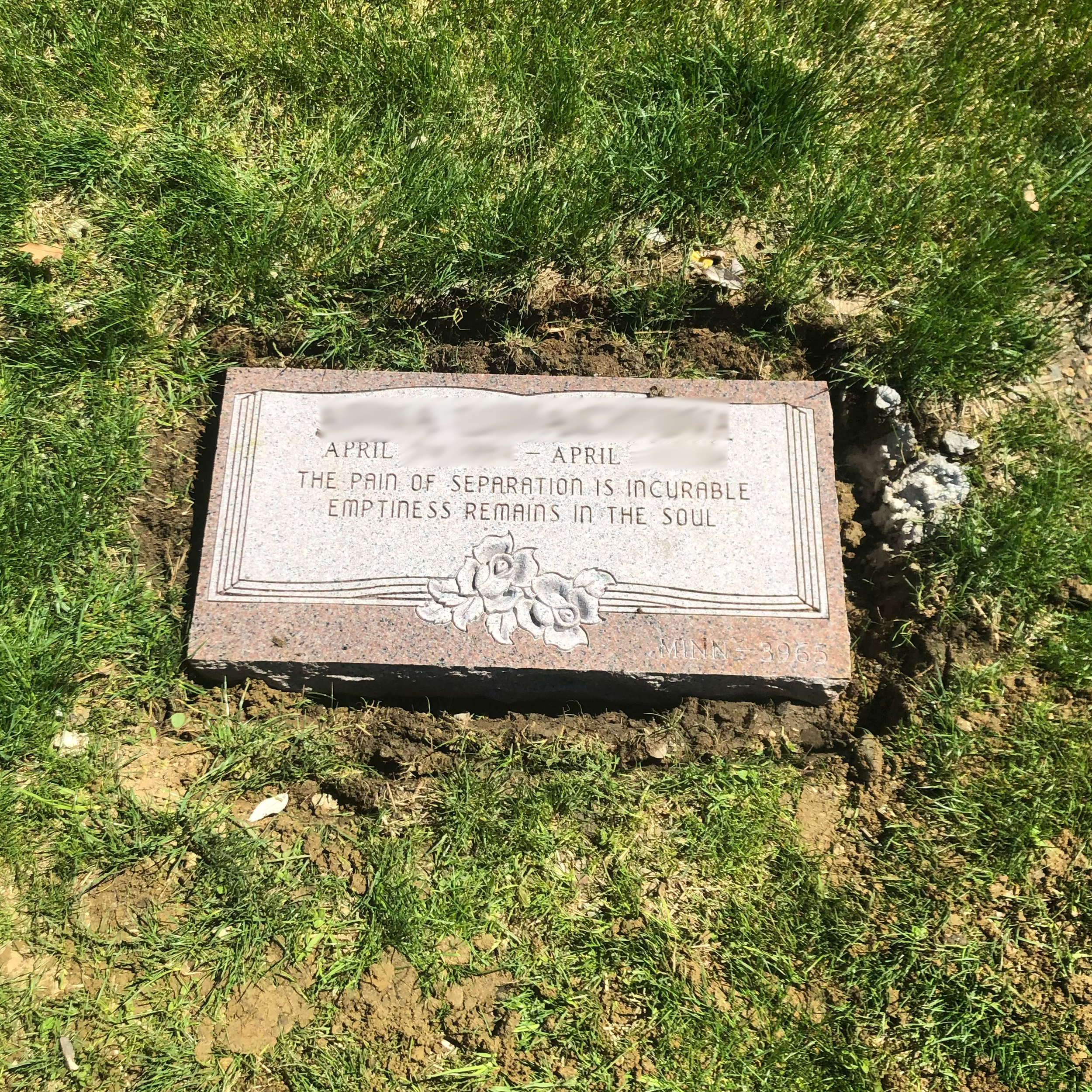 Low-profile flat monument showing custom decorative and engraving options.