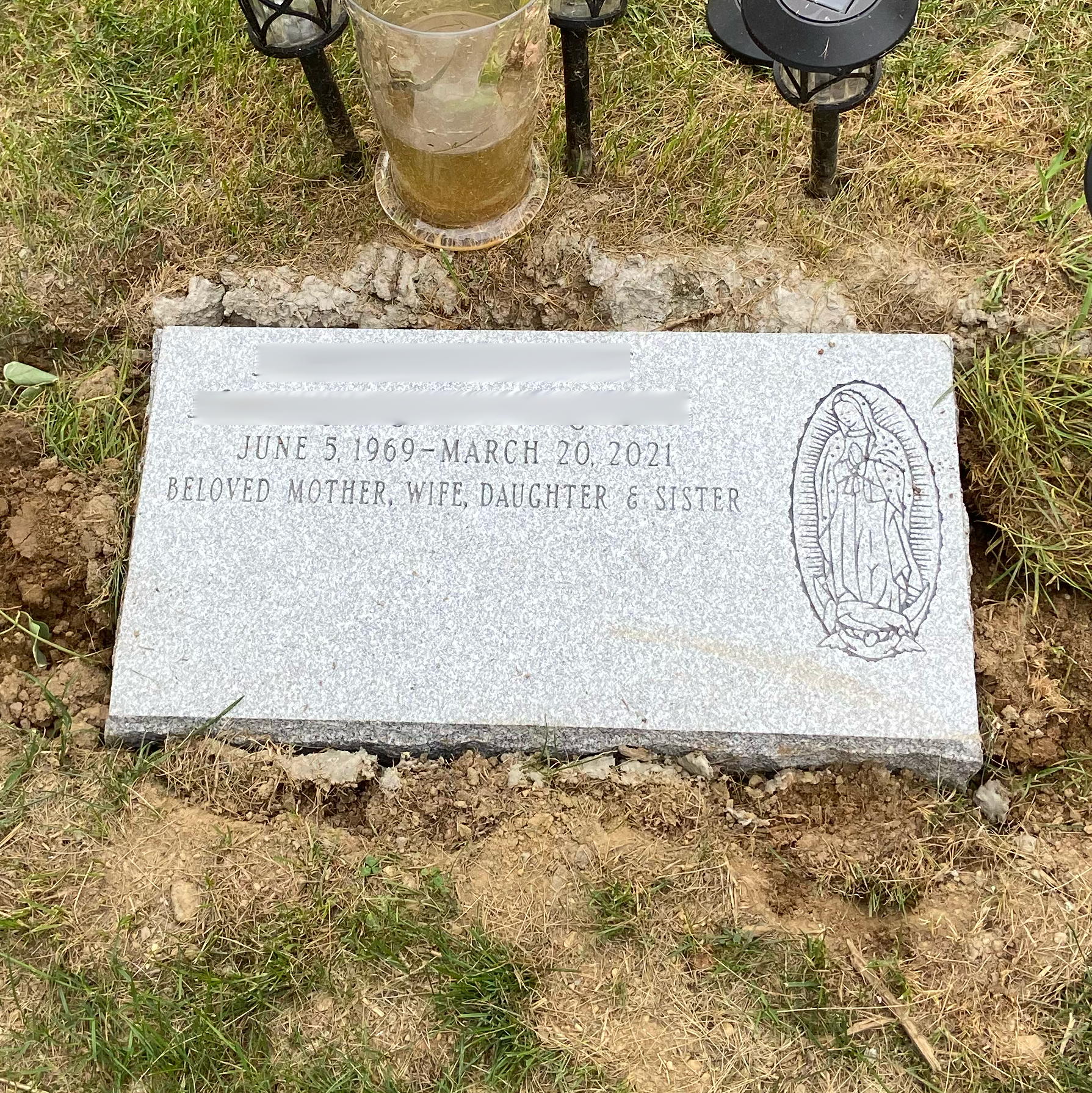 Low-profile flat granite monument showing custom decorative and engraving options.