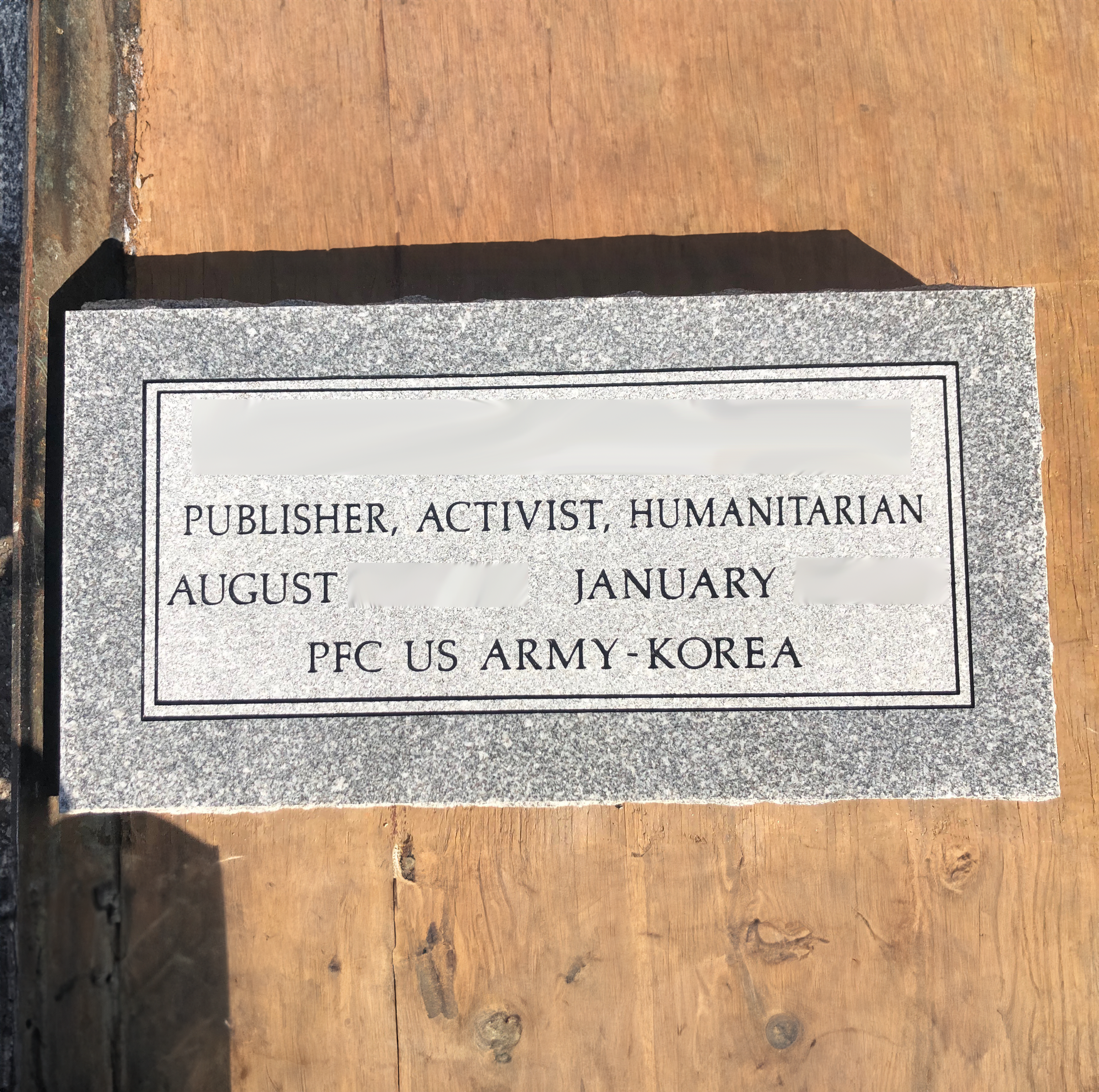 Low-profile flat granite monument showing engraving for a lasting memorial tribute.