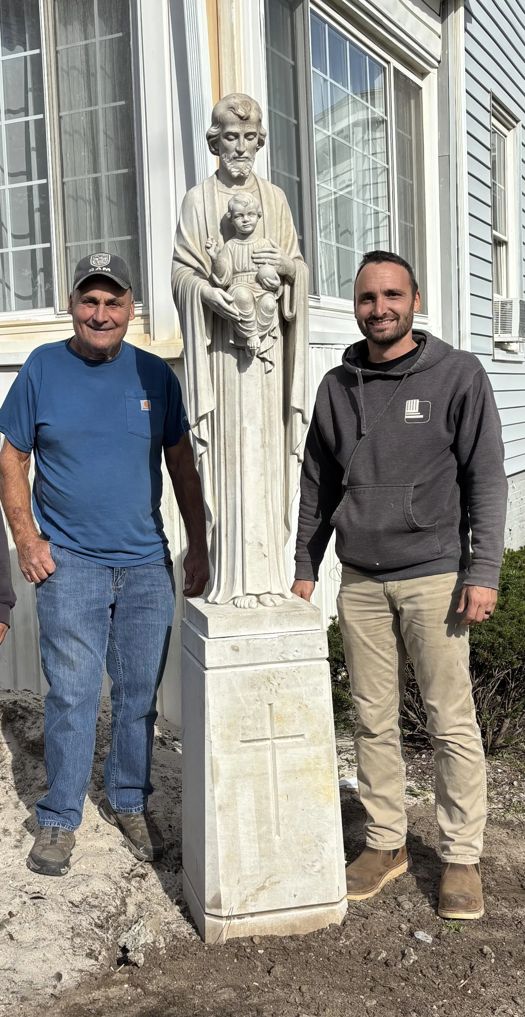Owner Rob Barelli with his father beside a memorial crafted by Leo's Monuments and Floral Co.