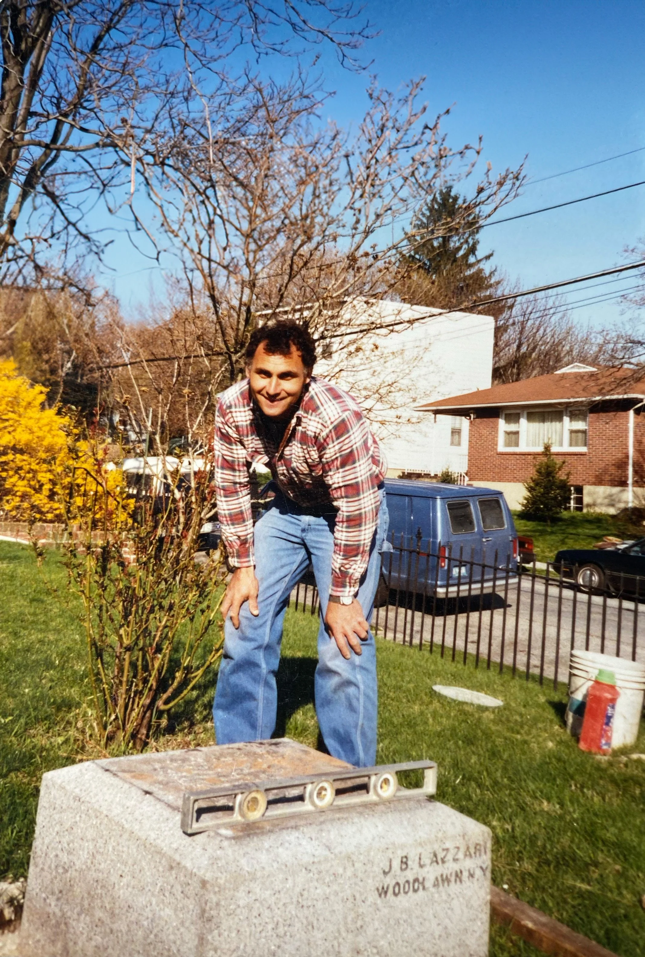 Rob Barelli's father installing a monument, showcasing generations of craftsmanship at Leo's Monuments and Floral Co.