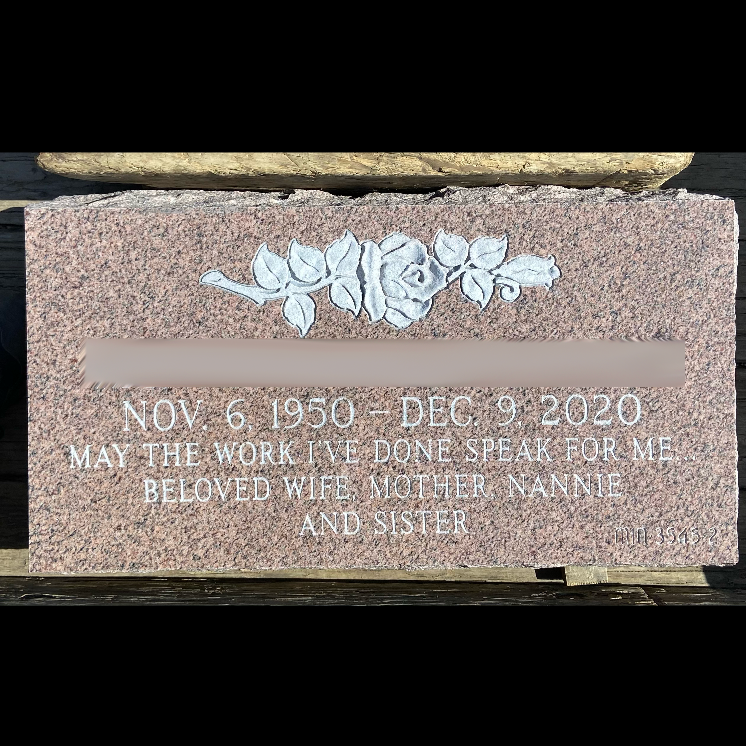 Low-profile flat granite monument showing custom decorative and engraving options.
