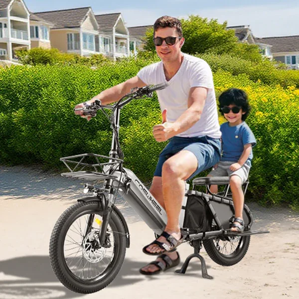 A man and a young child riding an electric bike outdoors on a sunny day, with green bushes and houses in the background. Both are wearing sunglasses, and the man is giving a thumbs-up.