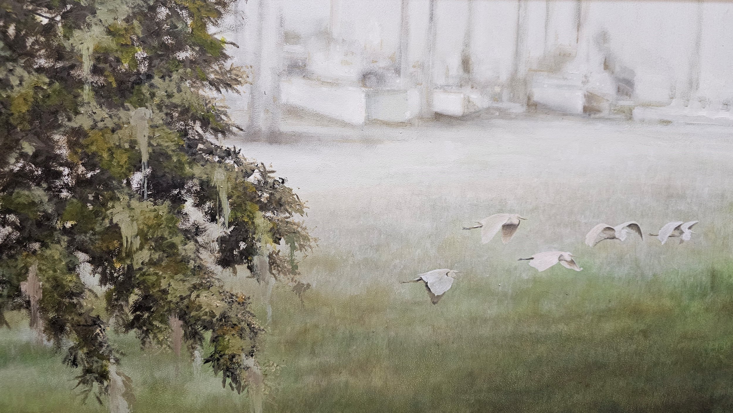 Painting of a grassy park with a leaning tree on the left, five white birds flying near the ground, and urban buildings in the background.