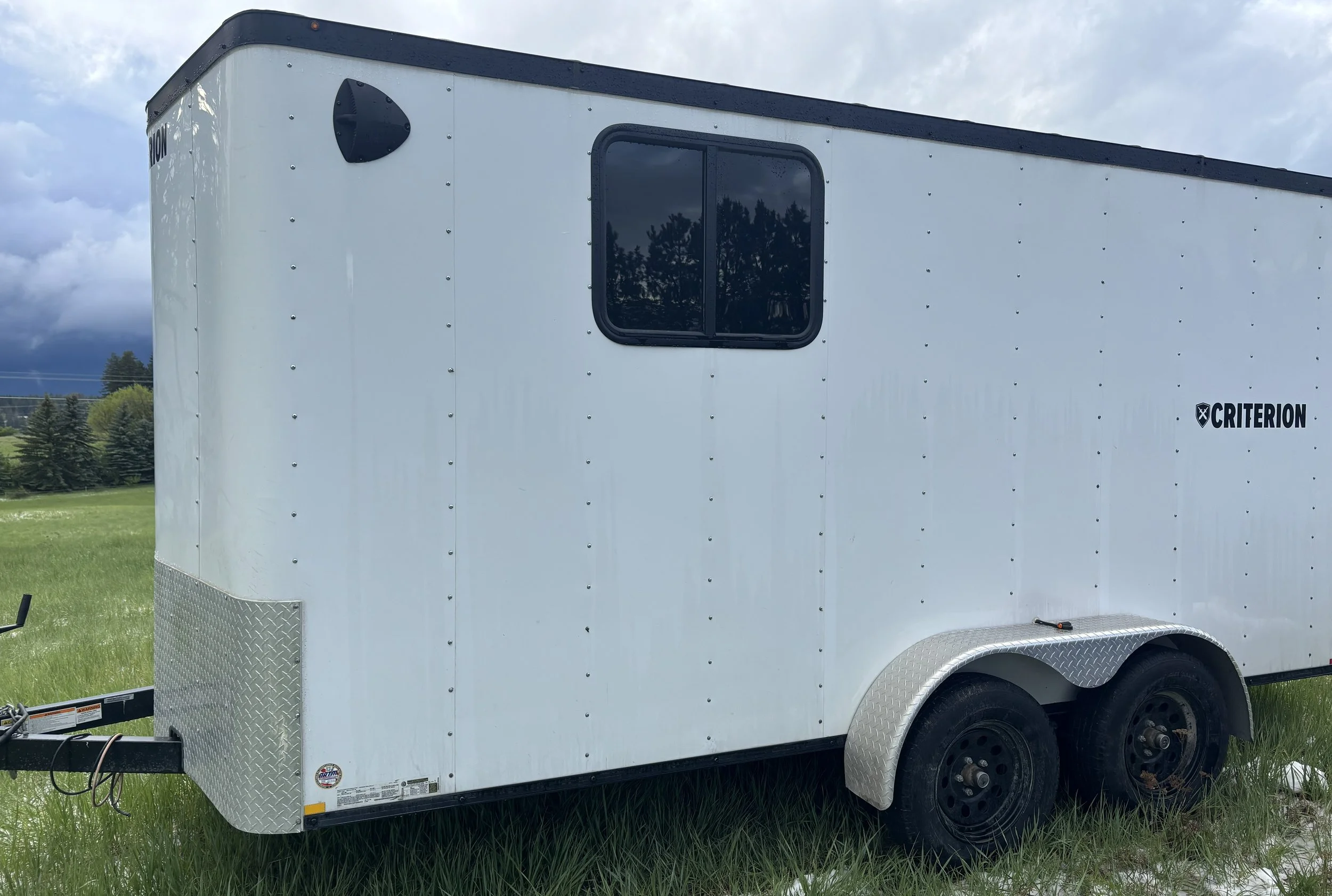 2023 Criterion 7'x14' Enclosed Trailer $74/day, $449/week, $1899 month HALF TON Towable! Pull down ramp door In-floor D-loops, Interior/Exterior Lighting 78” Inside Height GVWR 7000 lb, Tare 2200 lb, Max Payload 4800 lb