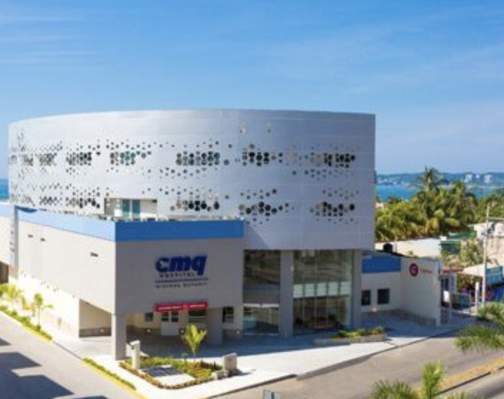 CMQ Hospital exterior in Puerto Vallarta, modern private medical facility near the ocean.