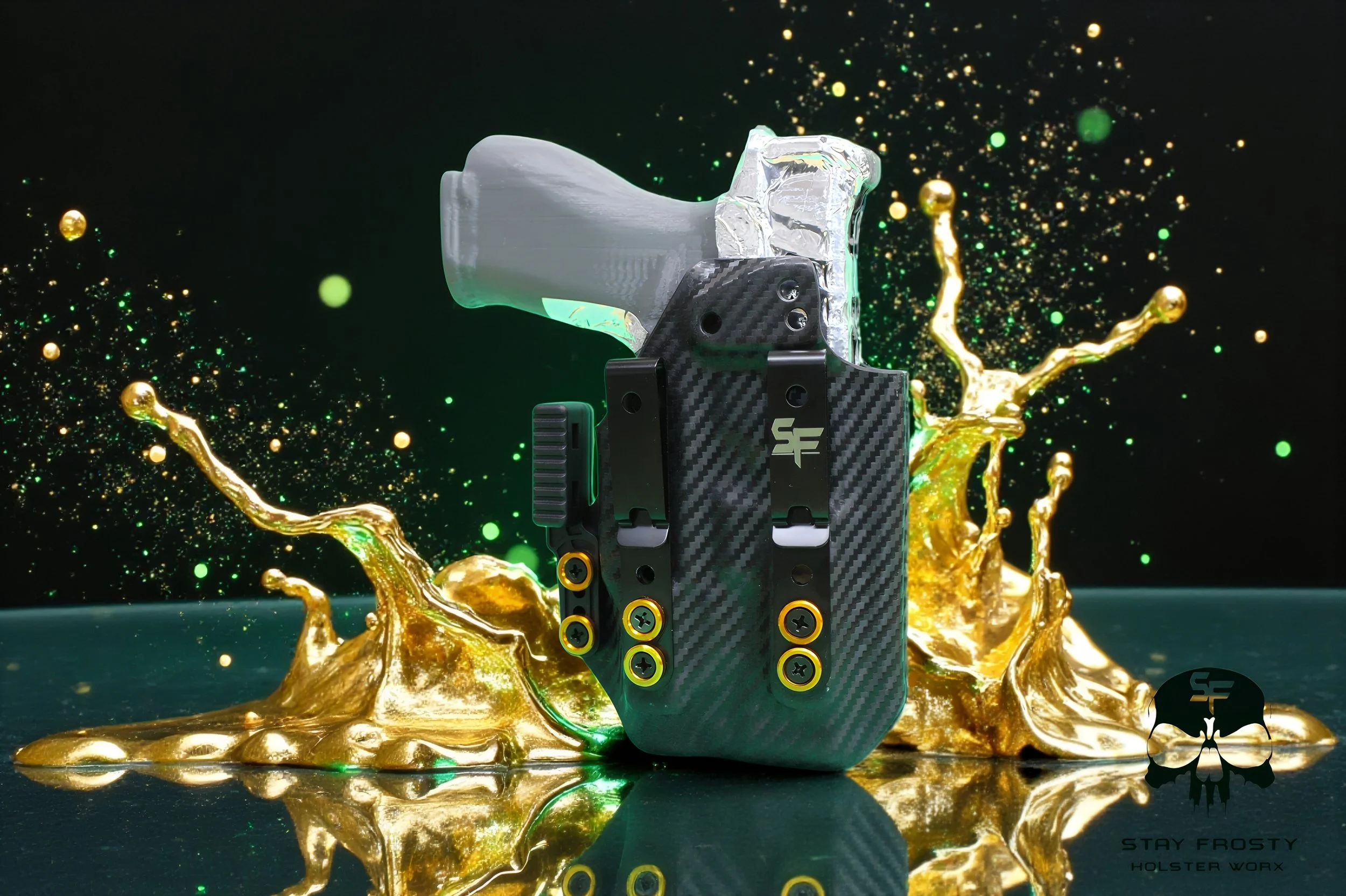 A high-tech, compact firearm with a carbon fiber body and metallic accents, mounted inside a transparent plastic container, set against a dark background with splashes of gold and green liquid. The image includes the logo and text 'Stay Frosty Holster Worx' in the bottom right corner.