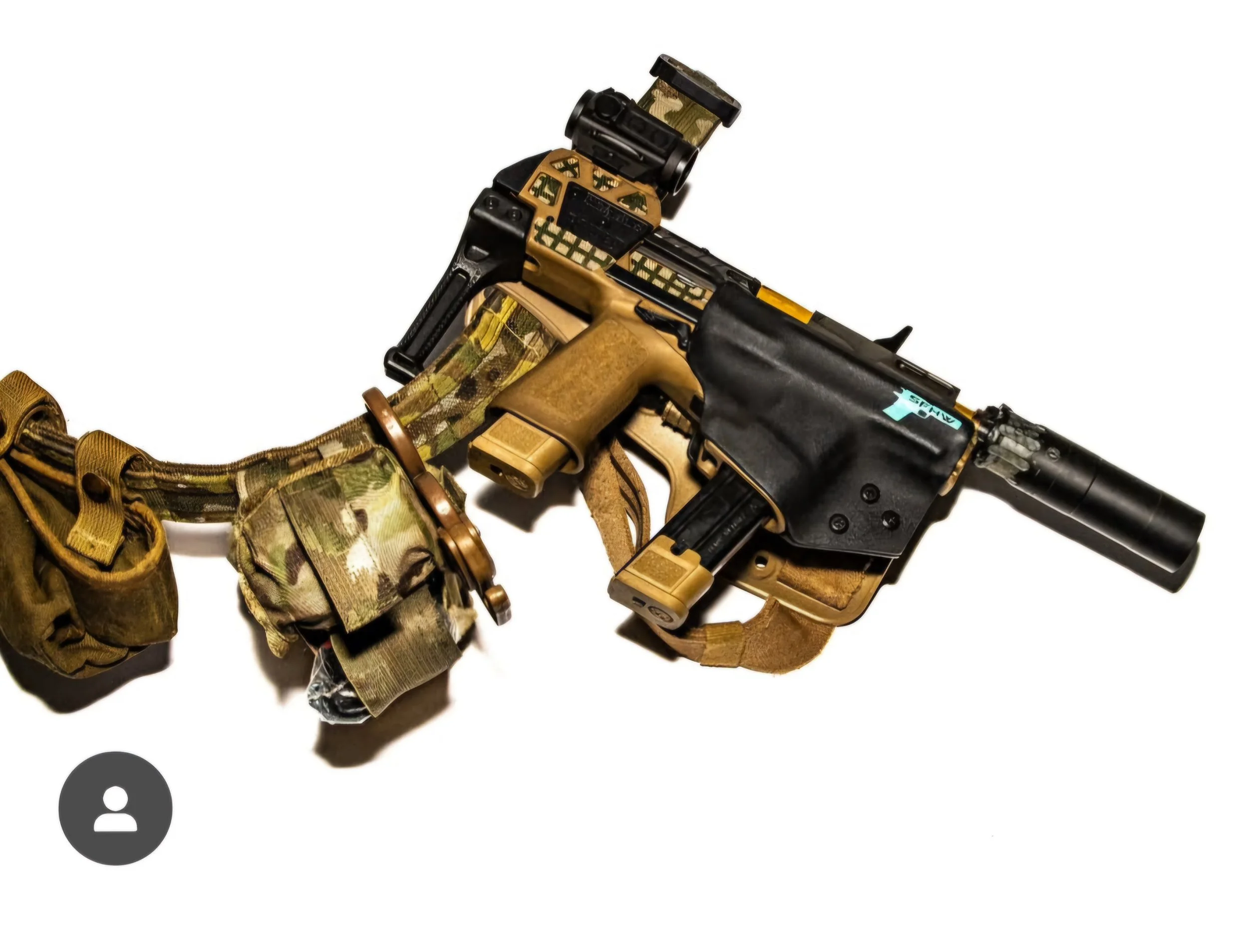 Tactical firearm with attachments and camouflage gear on a white background.