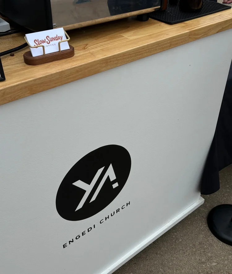 Coffee cart with a client logo on the front panel
