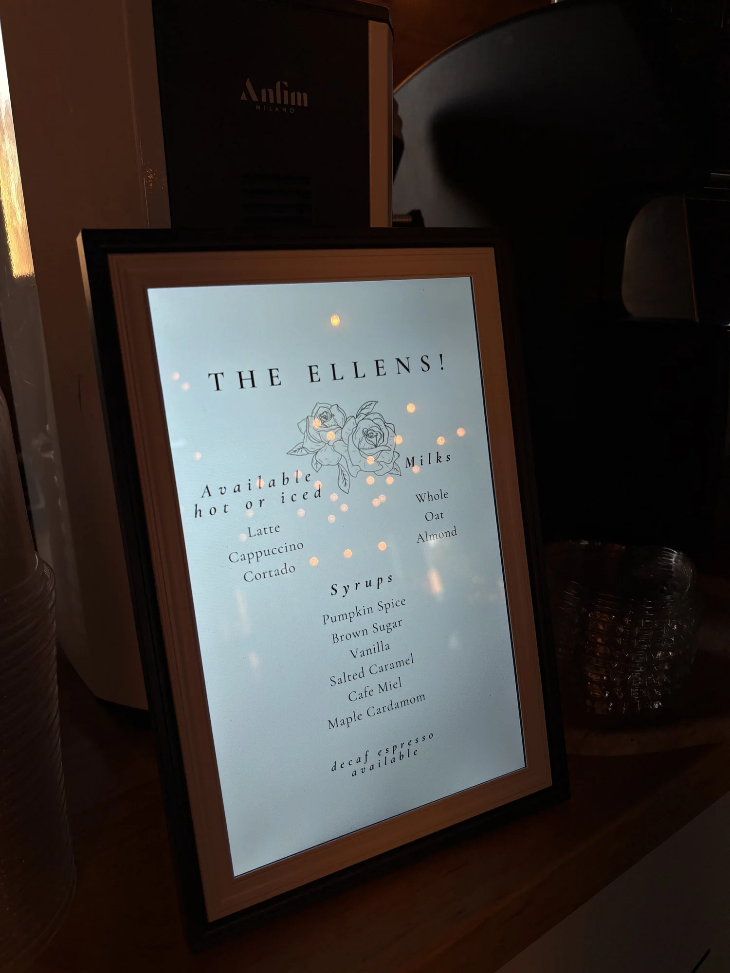 Custom drink menu sign with the hosts' name on the coffee cart