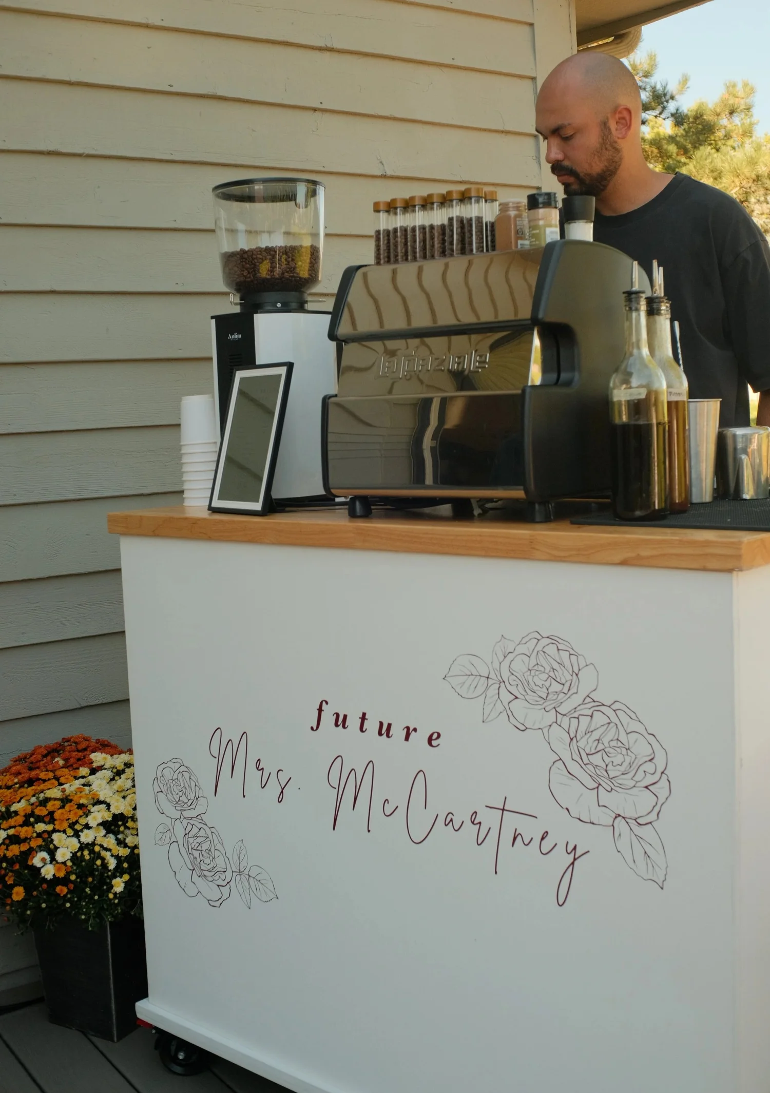 Slow Sunday coffee cart with a custom bridal sign and flowers