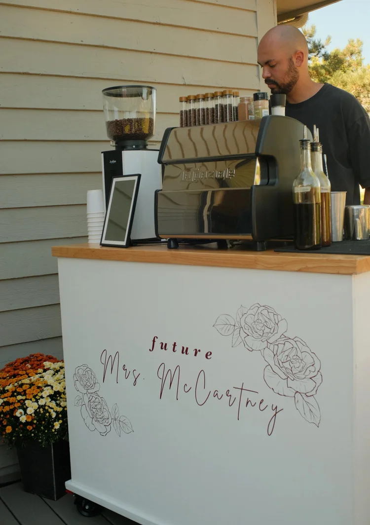 Espresso cart with a hand-lettered sign for a bridal shower