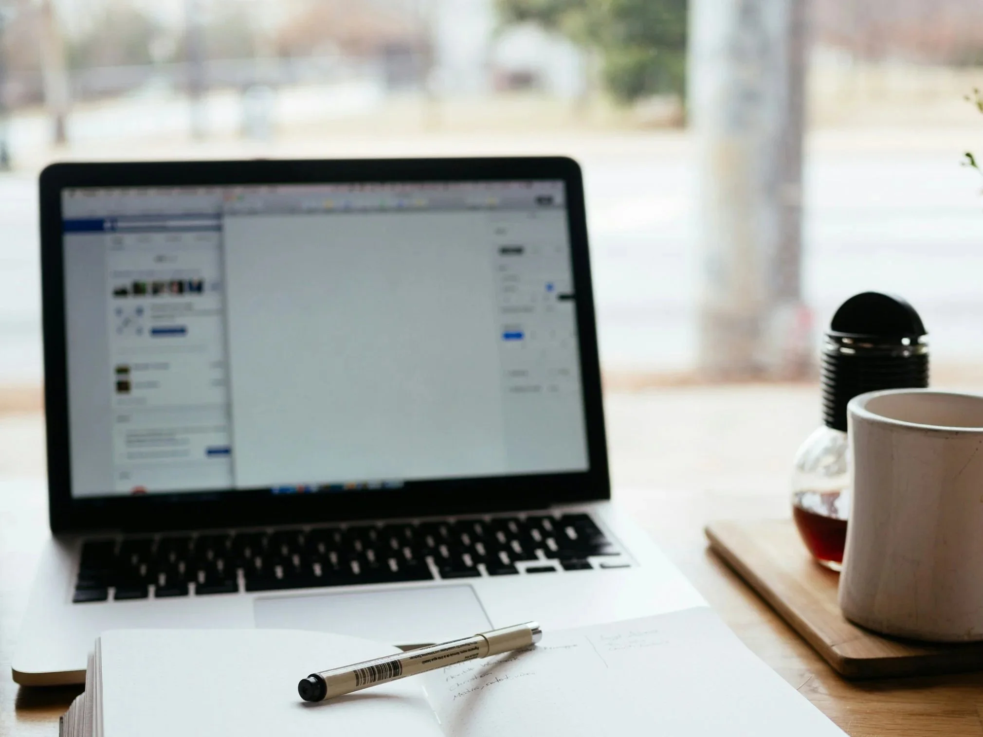 Laptop with Notebook and pen