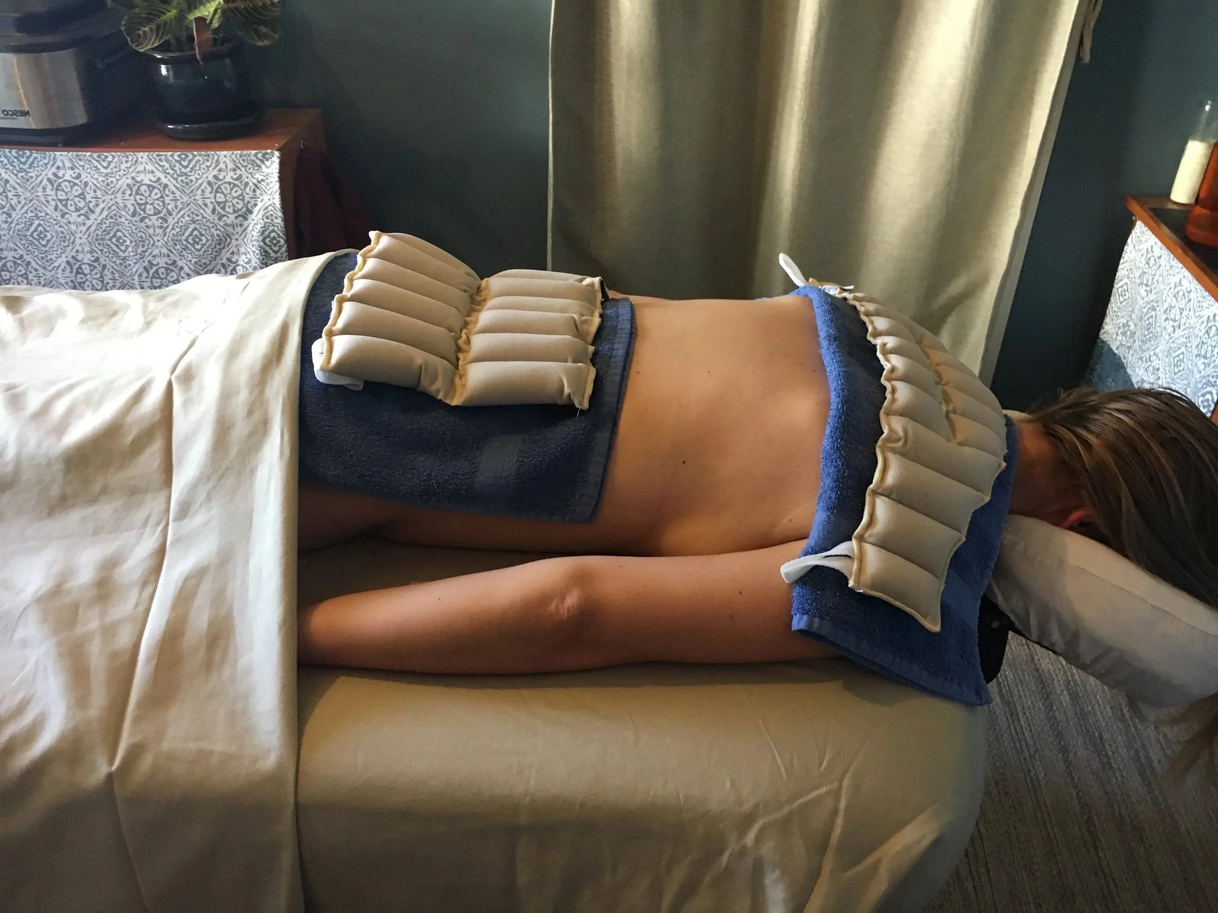 Massage therapy involving hydrotherapy packs.