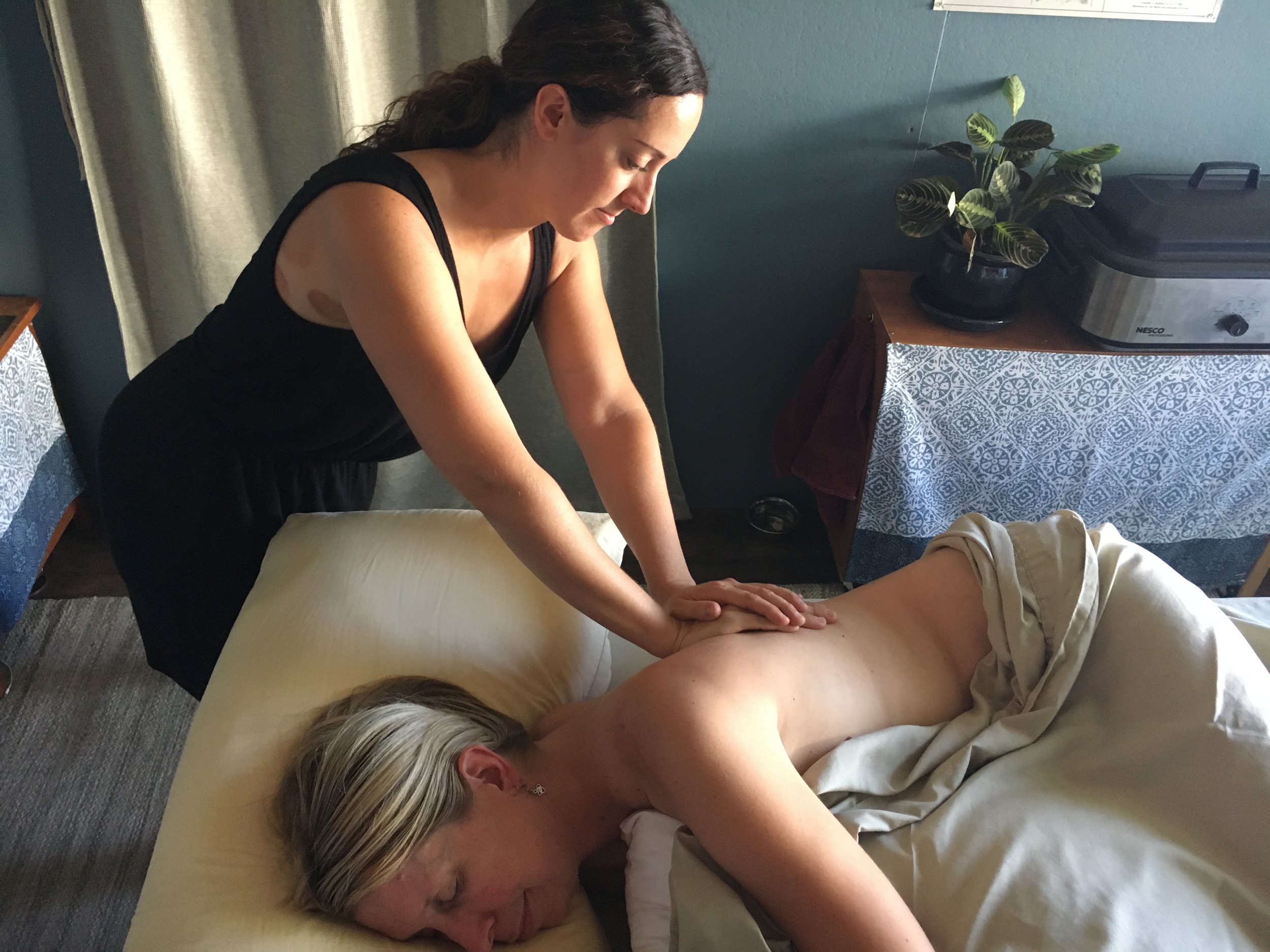Pregant person receiving prenatal massage