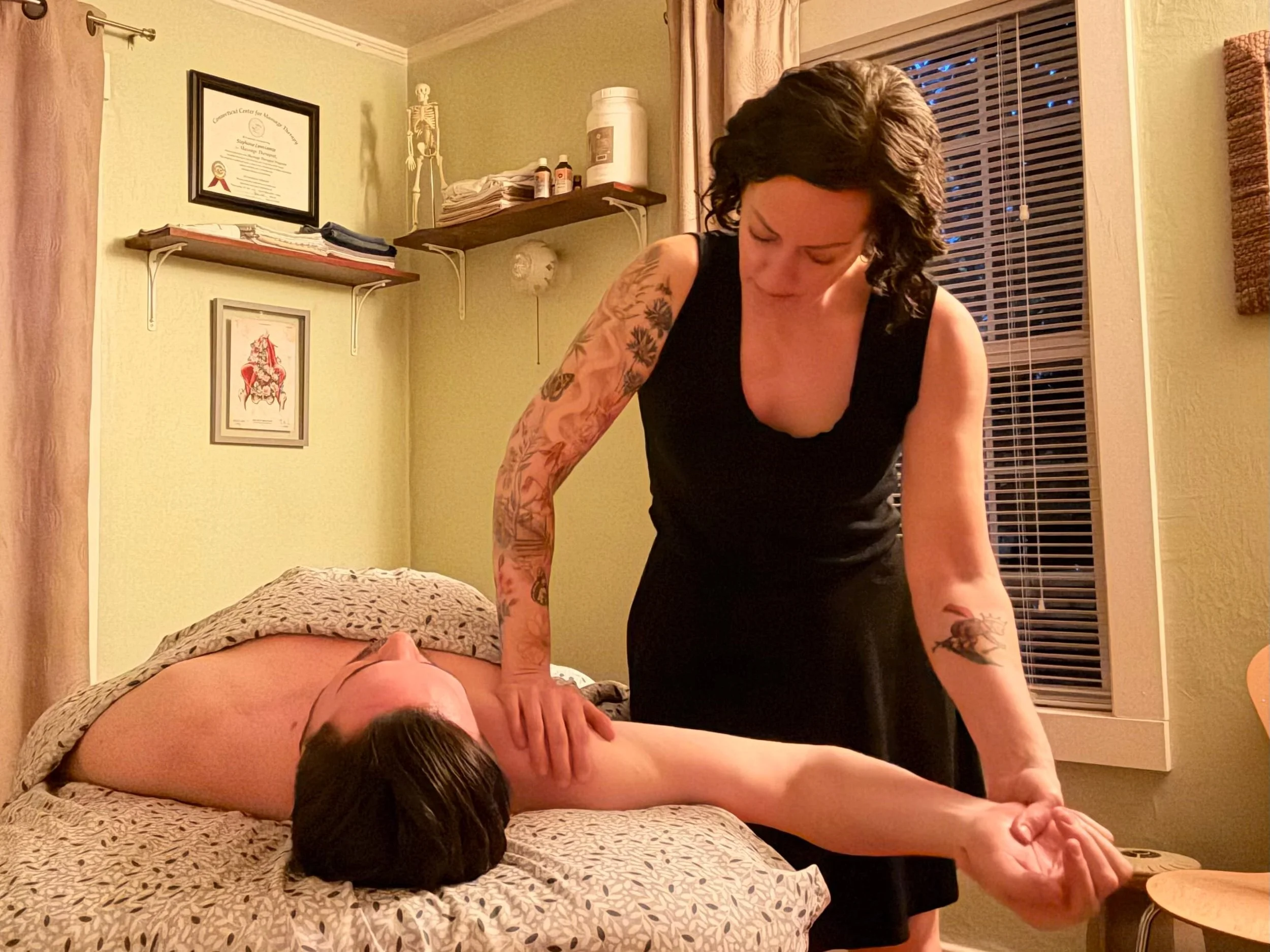 Portland massage therapist Steph George working with a client.