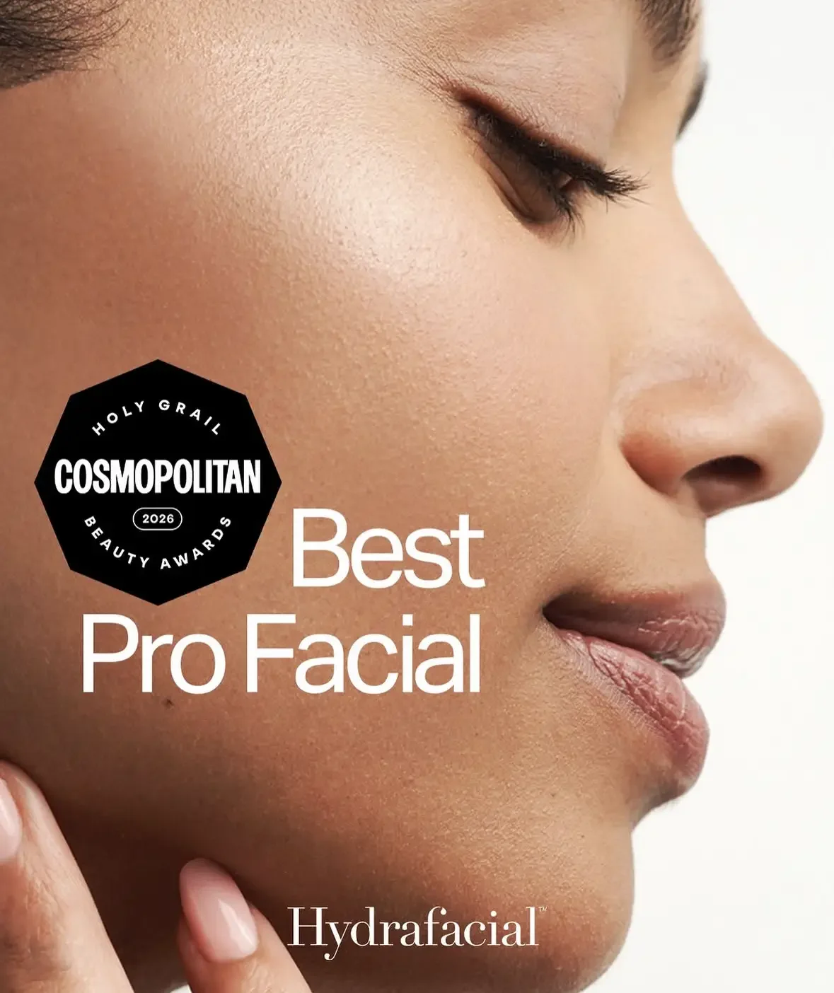Close-up of a woman's face showcasing clear, hydrated skin with text indicating she won the Cosmopolitan 2026 Best Pro Facial award, Hydrafacial, Beyond facials Santa Monica