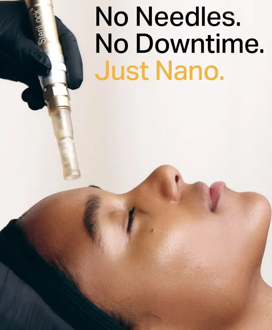 Close-up of a woman lying down with eyes closed, receiving a nano-technology treatment with a device held by a gloved hand. Text on the image reads, 'No Needles. No Downtime. Just Nano.' at Beyond Facials Santa Monica
