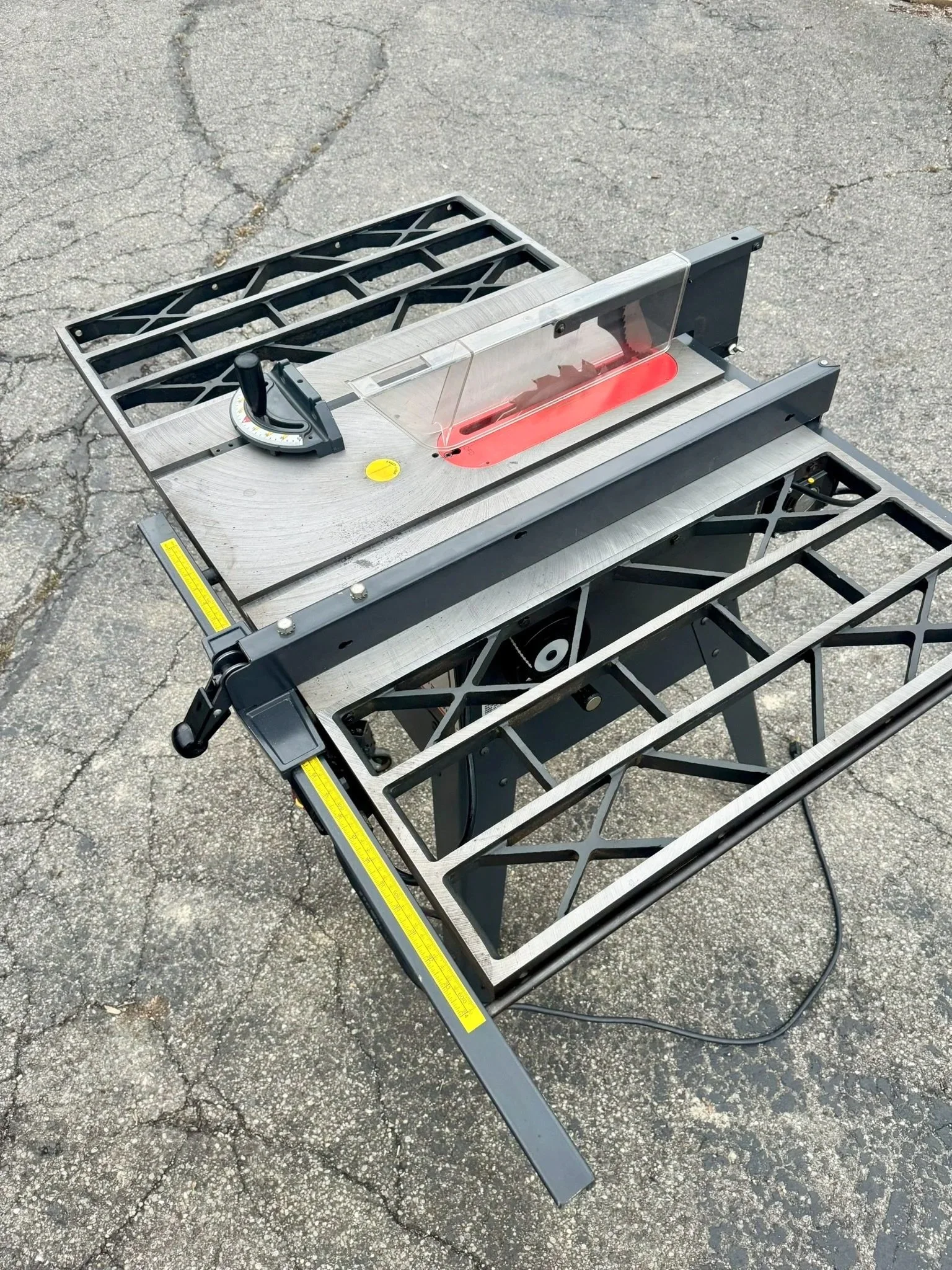 Restored vintage cast iron Craftsman table saw with heavy-duty extension wings