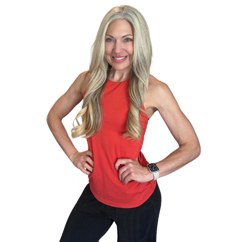 Coach Lacy smiling with her hands on her hips