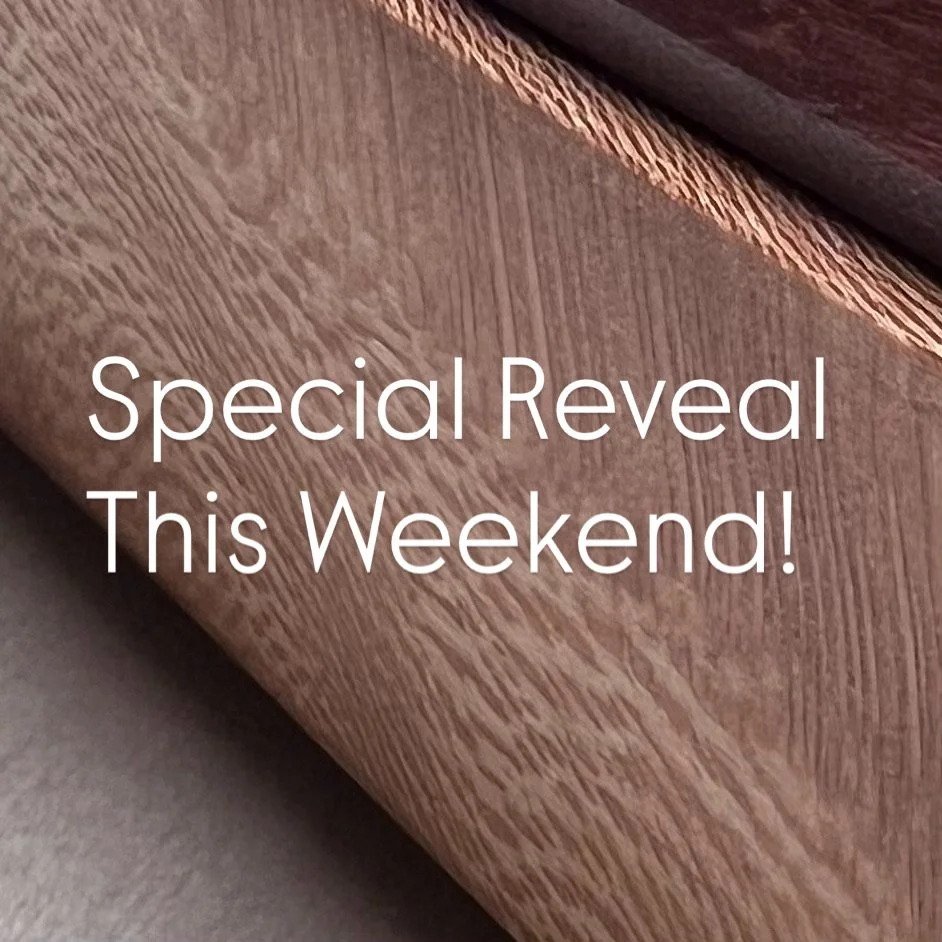 Close-up of a wooden surface with text overlay that reads "Special Reveal This Weekend!"